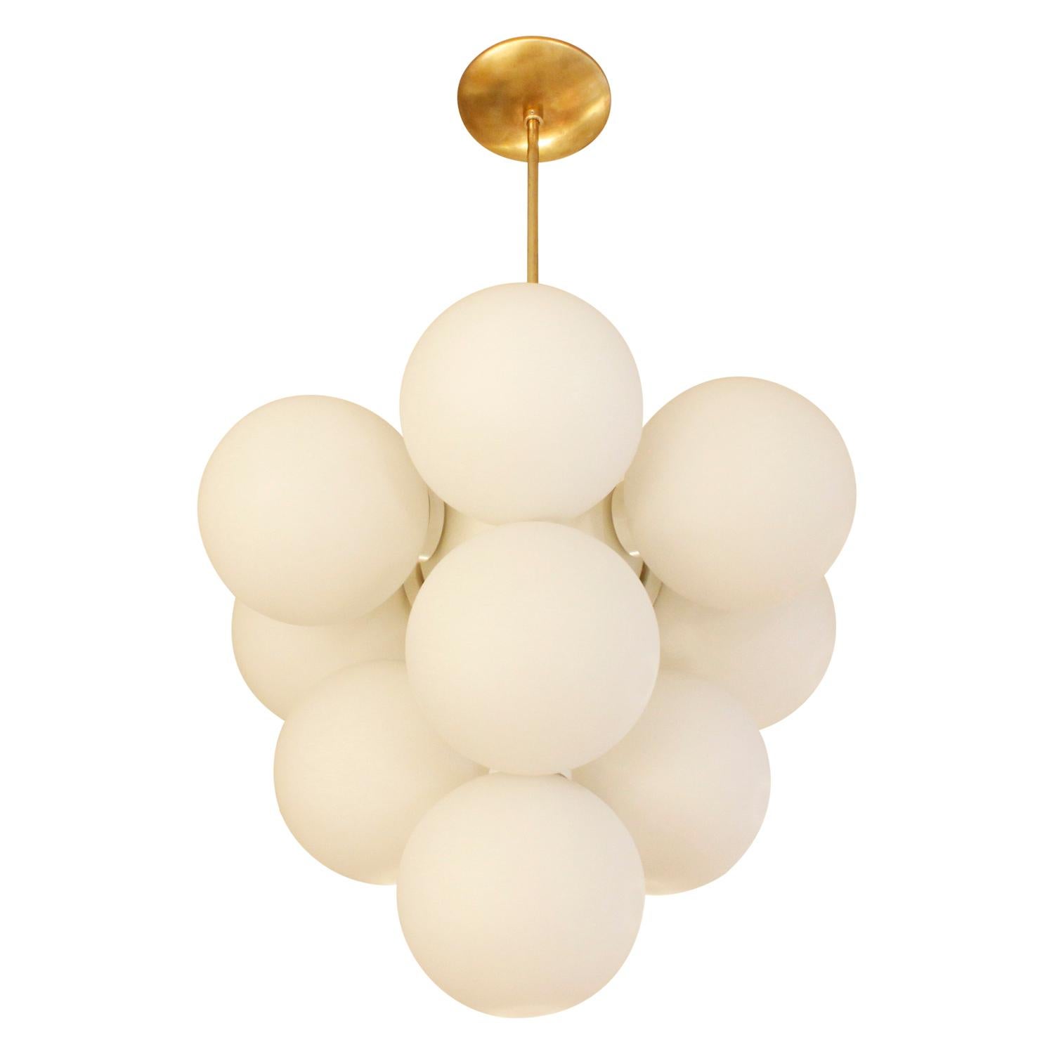 Sculptural chandelier in brass with white glass globes, German, 1960s.