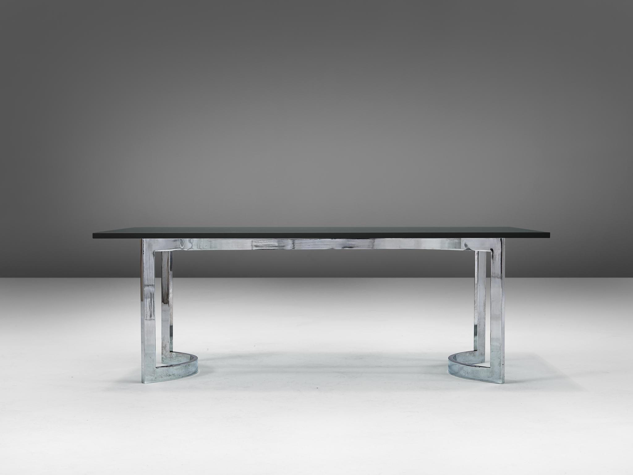 Coffee table, glass and metal, Europe, 1970s

Rectangular shaped cocktail table in chrome-plated steel and finished with a glass top. The piece embodies a simplistic, yet strong design and in combination with the materials this table has been made