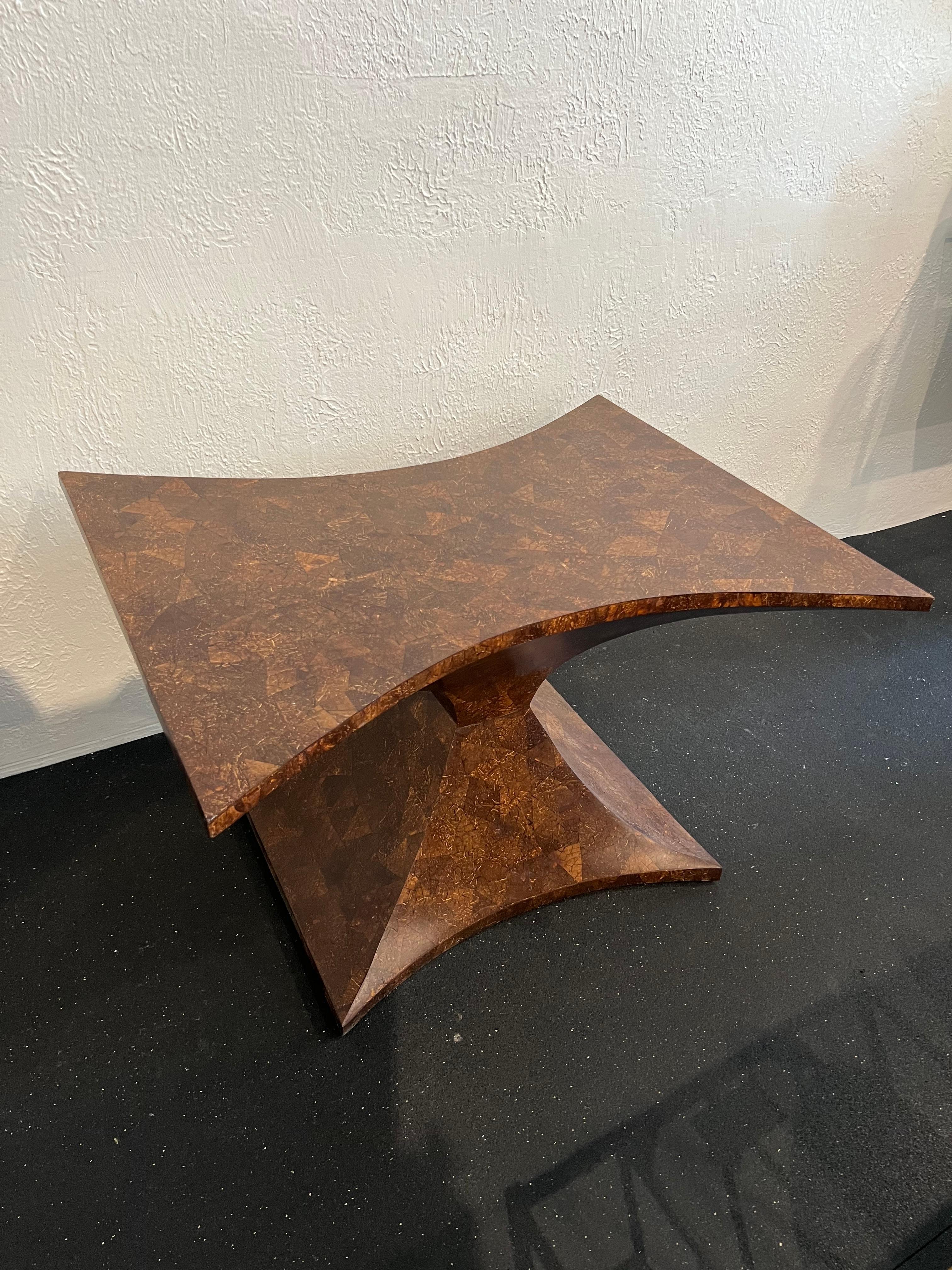 Sculptural coconut shell occasional table. Minor wear to finish. Please refer to photos (additional photos available upon request).

Would work well in a variety of interiors such as modern, mid century modern, Hollywood regency, etc. Piece blends