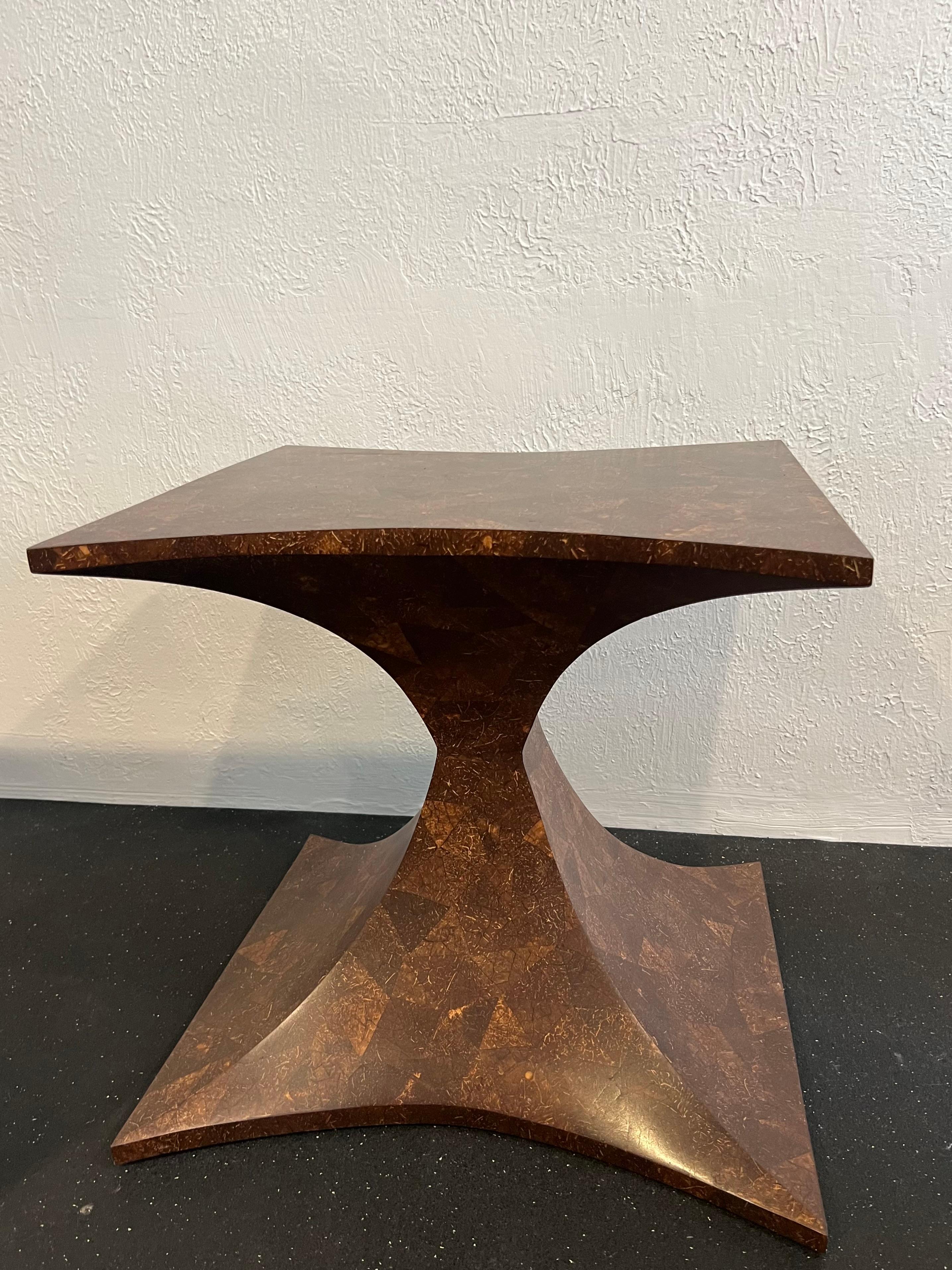Sculptural coconut shell side table. Minor wear to finish. Please refer to photos (additional photos available upon request).

Would work well in a variety of interiors such as modern, mid century modern, Hollywood regency, etc. Piece blends
