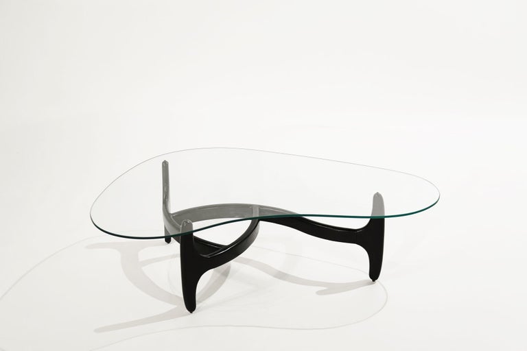 An ebonized oak coffee table featuring sculptural forms with an asymmetric glass top, completely restored. 
 
Other designers from this period include Vladimir Kagan, Hans Wegner, Paul McCobb, and T.H. Robsjohn-Gibbings.
