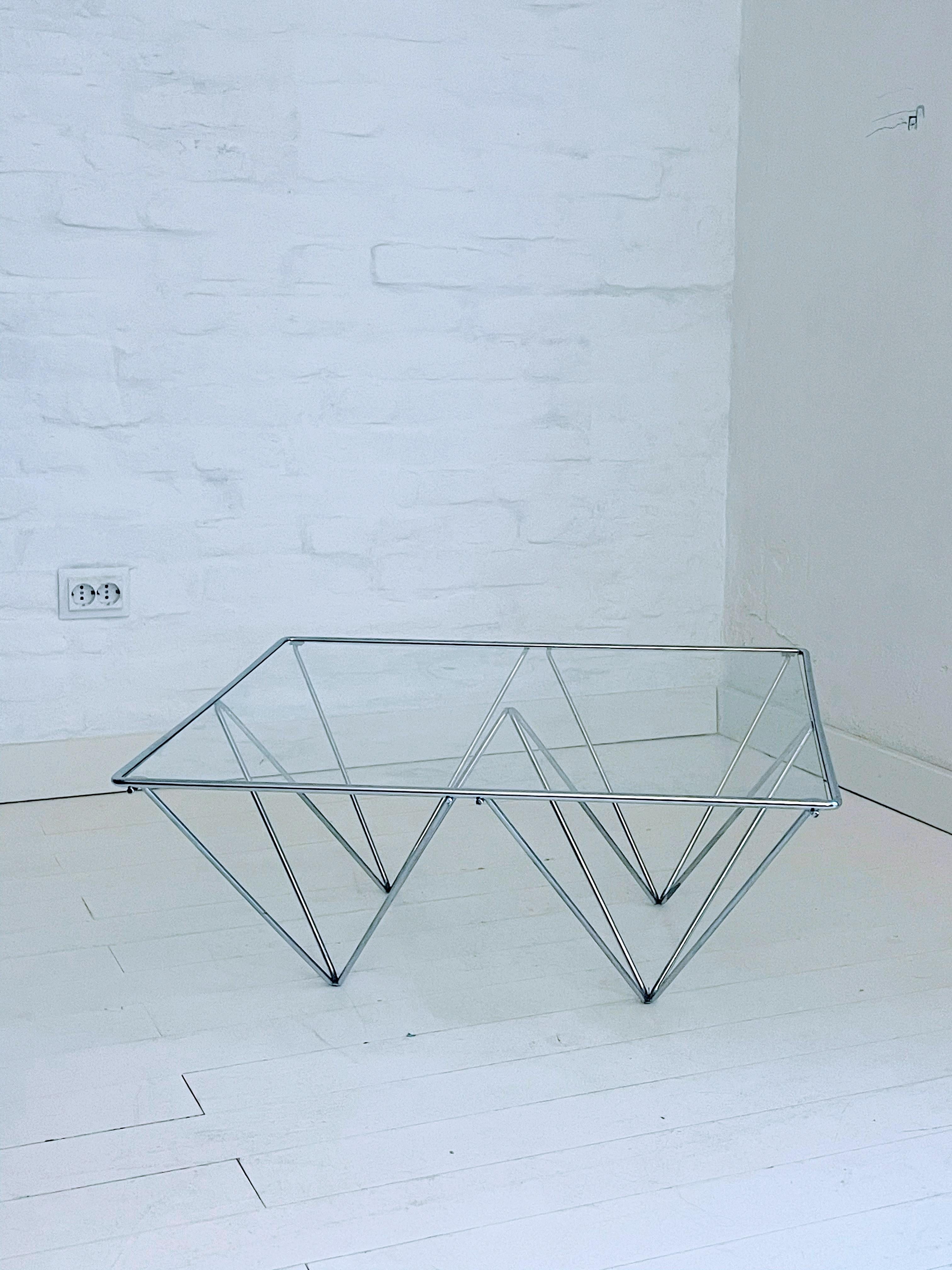 A beautiful and trendy coffee table in the style of Paolo Piva for B&B Italy, 1980s.
It could be used also as side table.
Made of chromed steel with a clear glass top. The glass is the original one.
Excellent vintage condition.
 