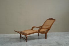 Sculptural Colonial Chaise Longue in Wood and Webbing Early 20th Century