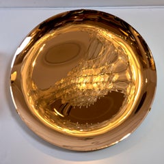 Specchio scultoreo concavo in oro rosa