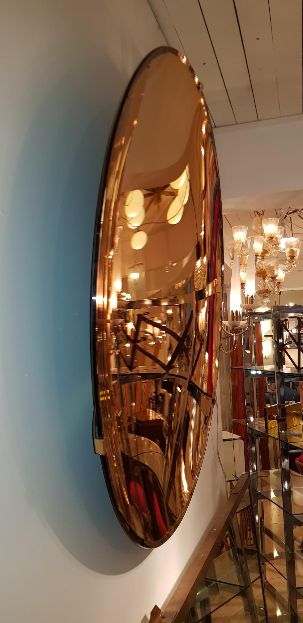 Mid-Century Modern Sculptural Concave Rose Gold Mirror For Sale