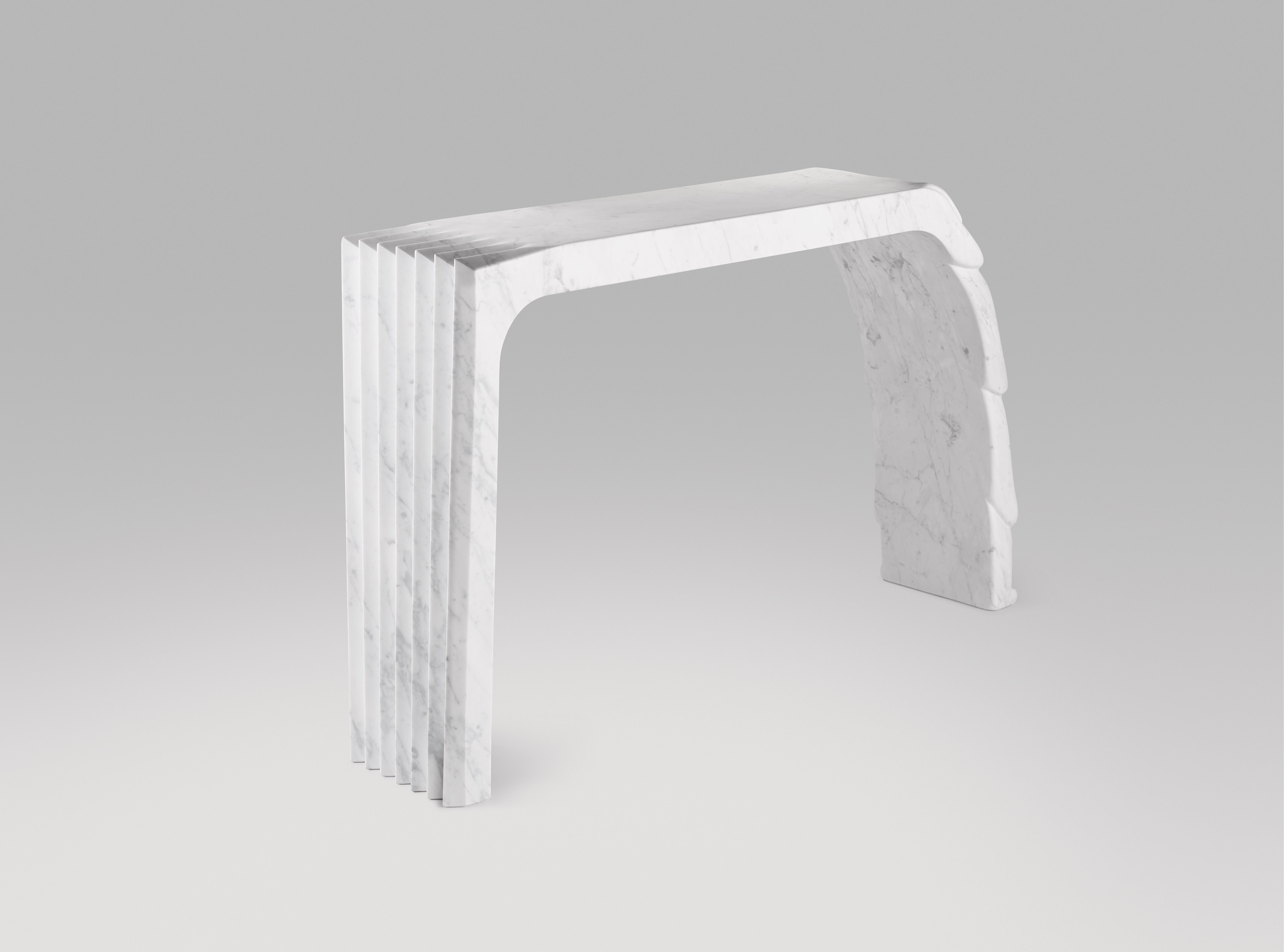 Unique- piece sculptural console engraved from a solid block of Carrara marble.
The evolution from sharp hedgy shapes (left side) to smooth round melting material  (right side).