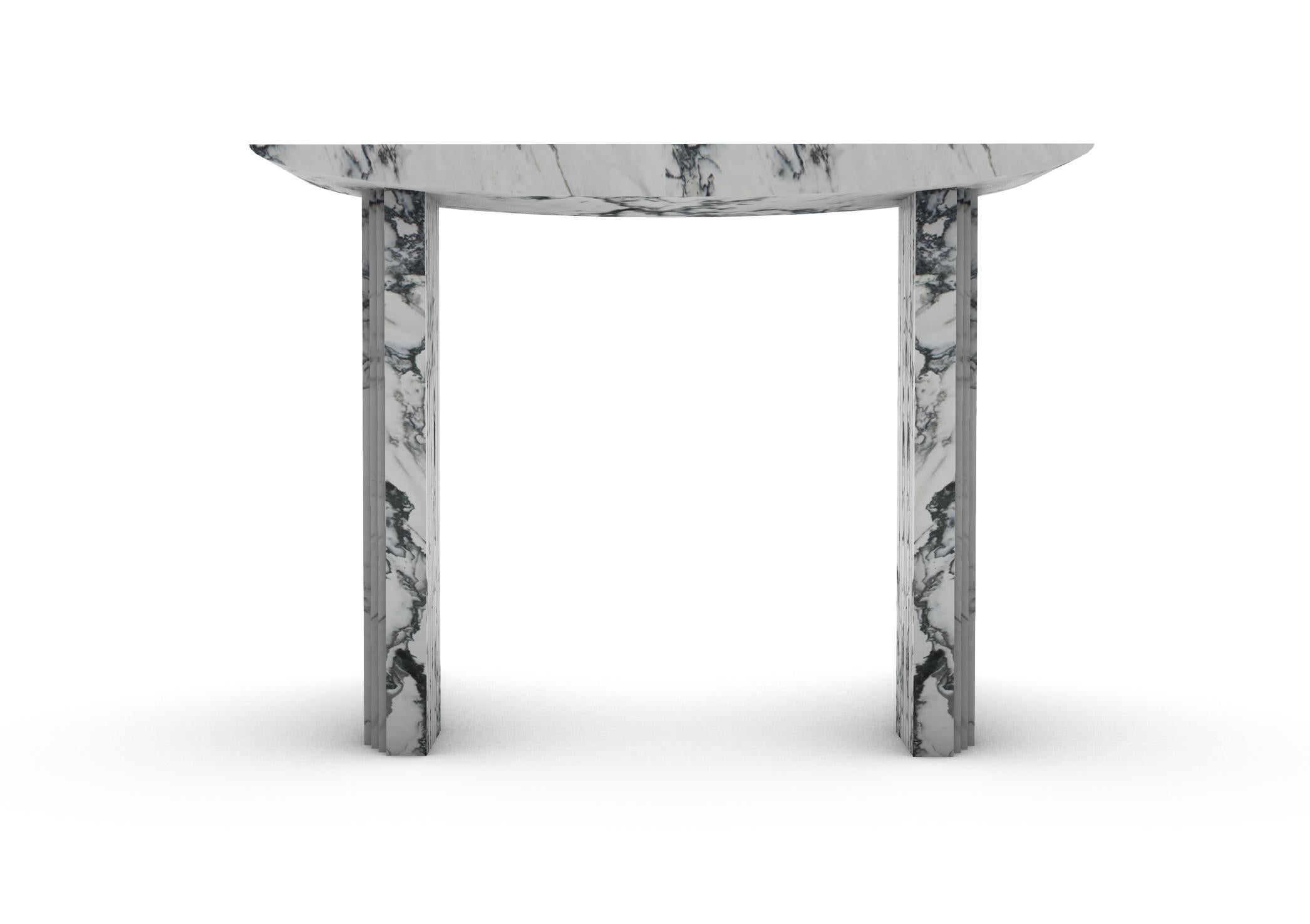 “Console 0024c” is a sculptural console table in Paonazzo Marble  created by the artist Desia Ava. 
The piece features strong lines and gentle curves. Marked by architectural aesthetics, on the borderline between sculpture and furniture the Marble