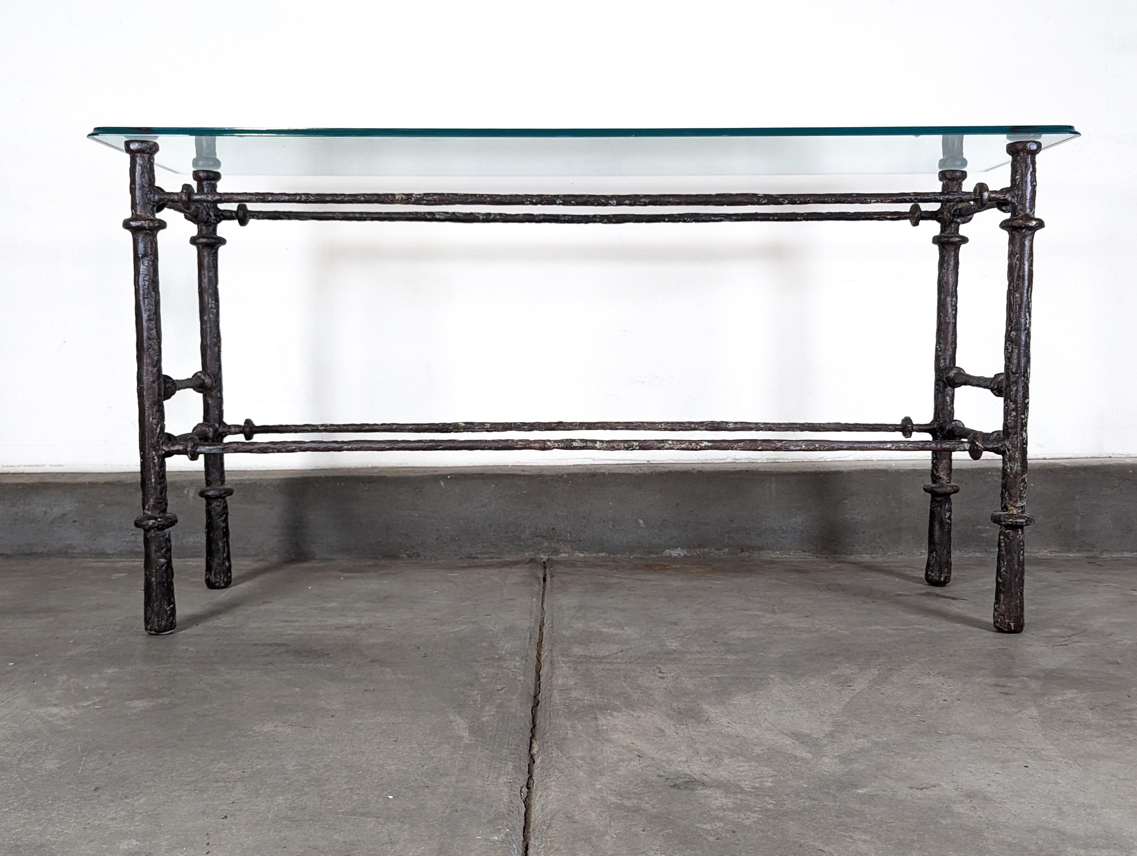Elevate your living space with this exquisite vintage mid-century console table, reminiscent of the masterful artistry of Diego Giacometti. Crafted in the 1970s, this piece embodies the timeless elegance and sophisticated design characteristic of