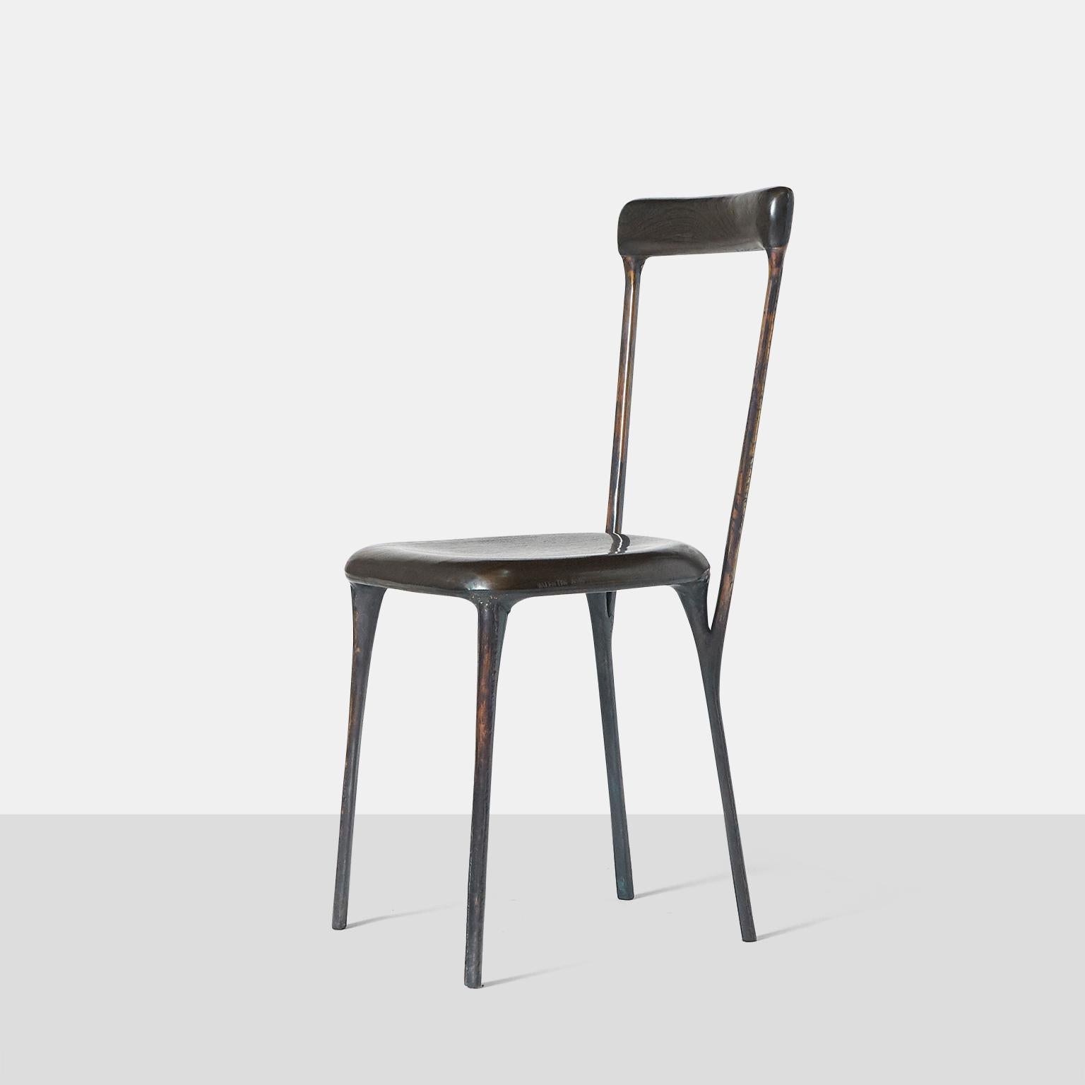 A side chair by German furniture designer Valentin Loellmann, circa 2017. Completely hand constructed in bcopper and not cast, with a charred oak seat and back in wenge that has been made to fit the curved shape. The brass construction creates a