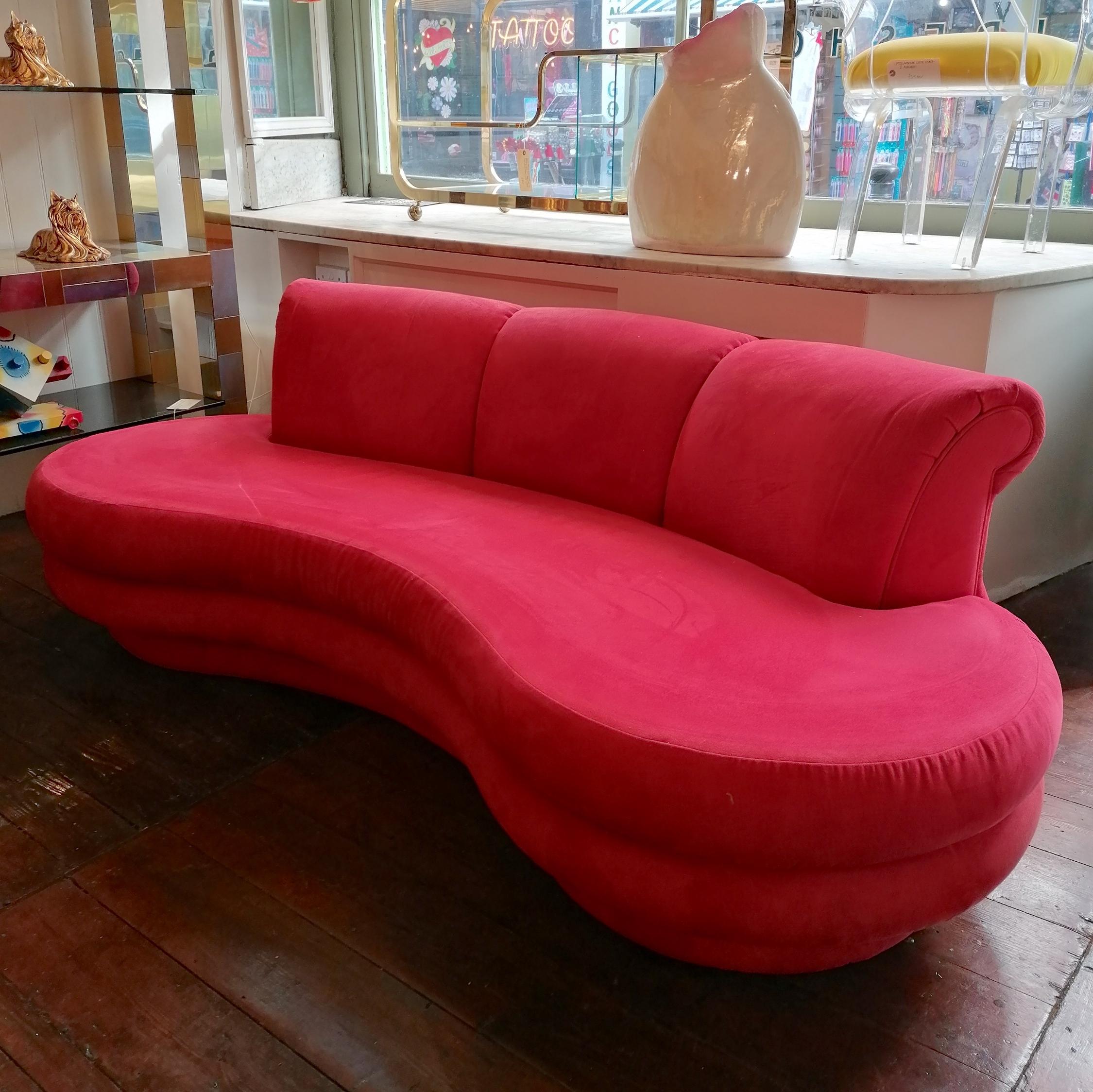 Stunning sculptural curved cloud sofa by Adrian Pearsall for Comfort Designs, USA 1980s. The original raspberry red (or lipstick red?) ultrasuede upholstery is in great condition for its age. A really comfortable sofa.
Please note: the white streak