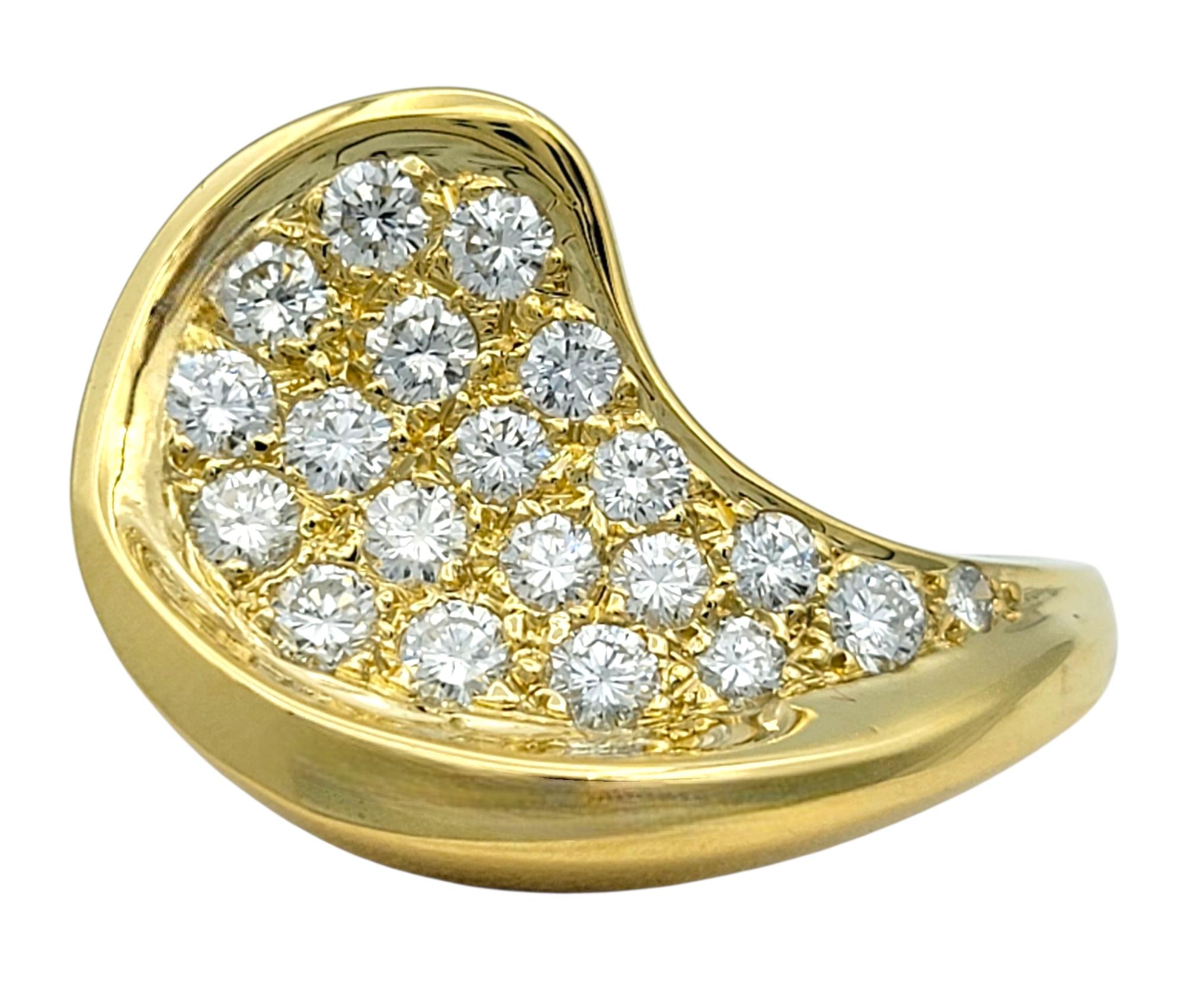 Ring Size: 6.25 

This bold and luxurious diamond ring features a sweeping, asymmetrical wave design fully set with brilliant round diamonds. The polished surface curves with elegance, while the pavé-set diamonds follow the form in a dramatic arc,