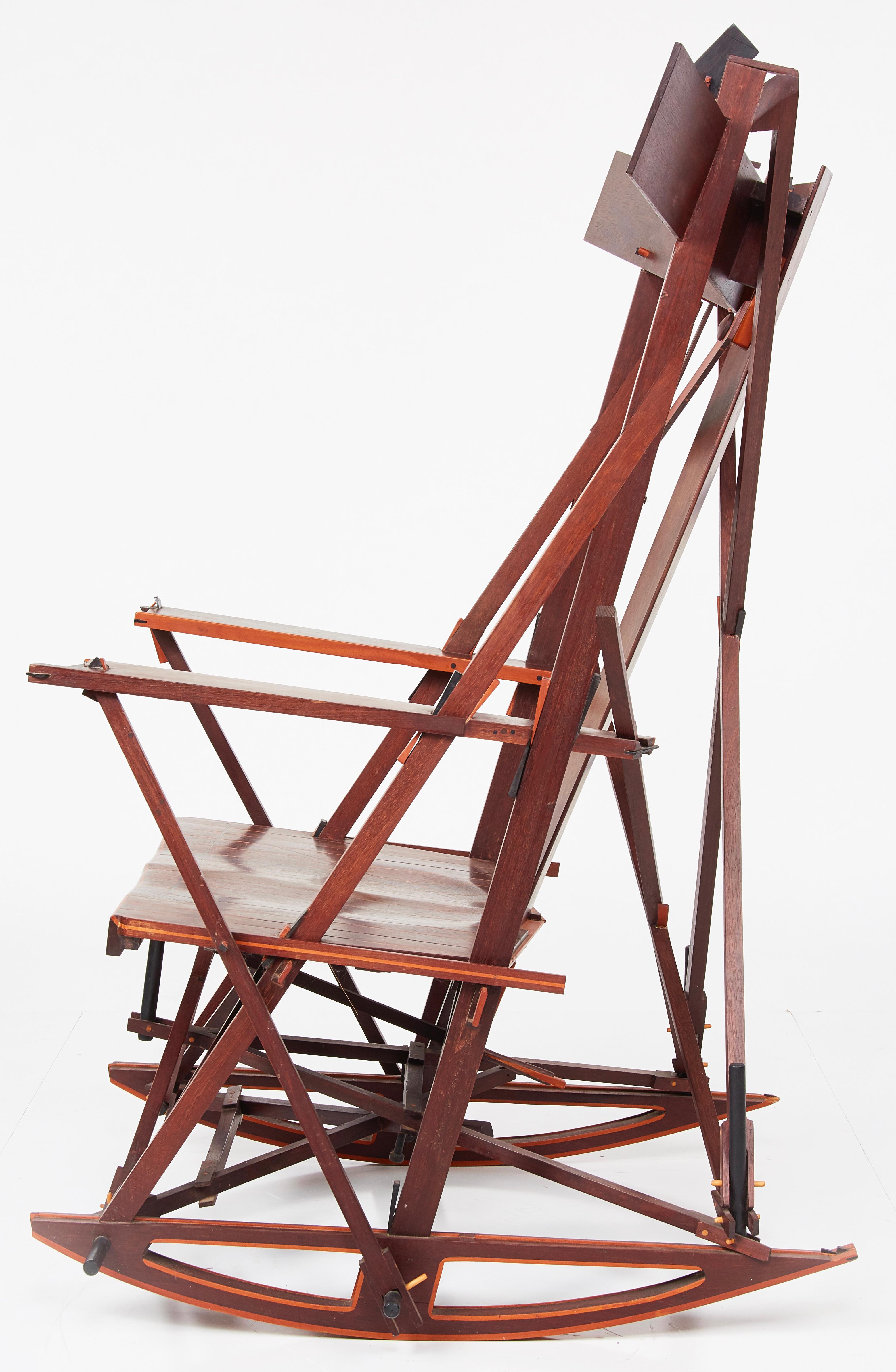 An incredible custom rocking chair by Bernie Lubell. A fantastic, maximally constructed architectural piece, chockablock with wonderful details large and small. Well built and fully functional, seemingly a study in joinery and mixed-woods lamination
