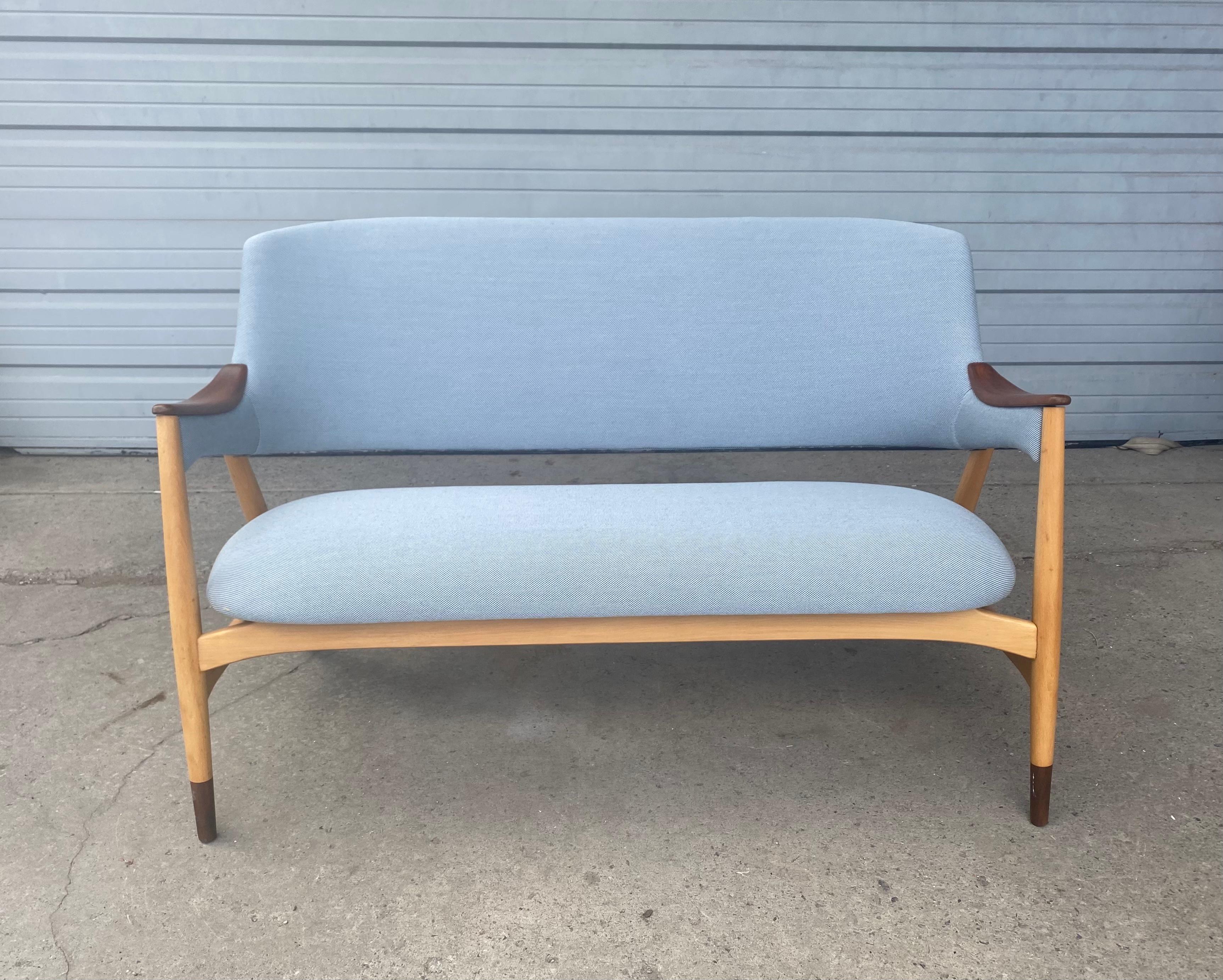 Sculptural Danish beach and teak settee designed by Jens Hjorth, Randers Stolefabrik 1950s Professionally restored reupholstered. Superior quality and construction, Extremely comfortable, Hand delivery avail to new York City or anywhere en route