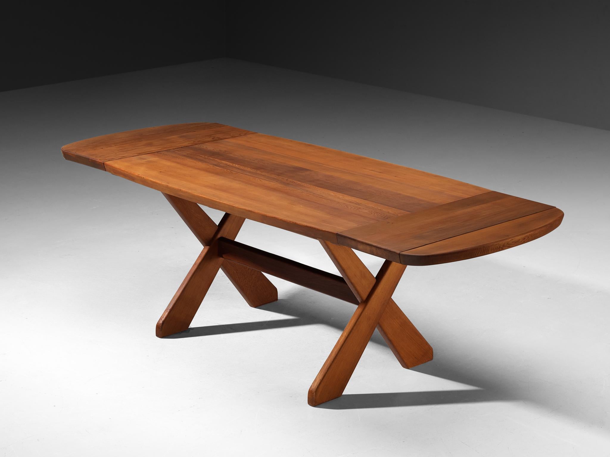 Extendable dining table, Oregon pine, Denmark, 1970s

This 70s Danish dining table carries a quirky confidence and warm personality. Made from Oregon pine, its surface is broad and flat, with softly rounded edges.  The legs are the most striking