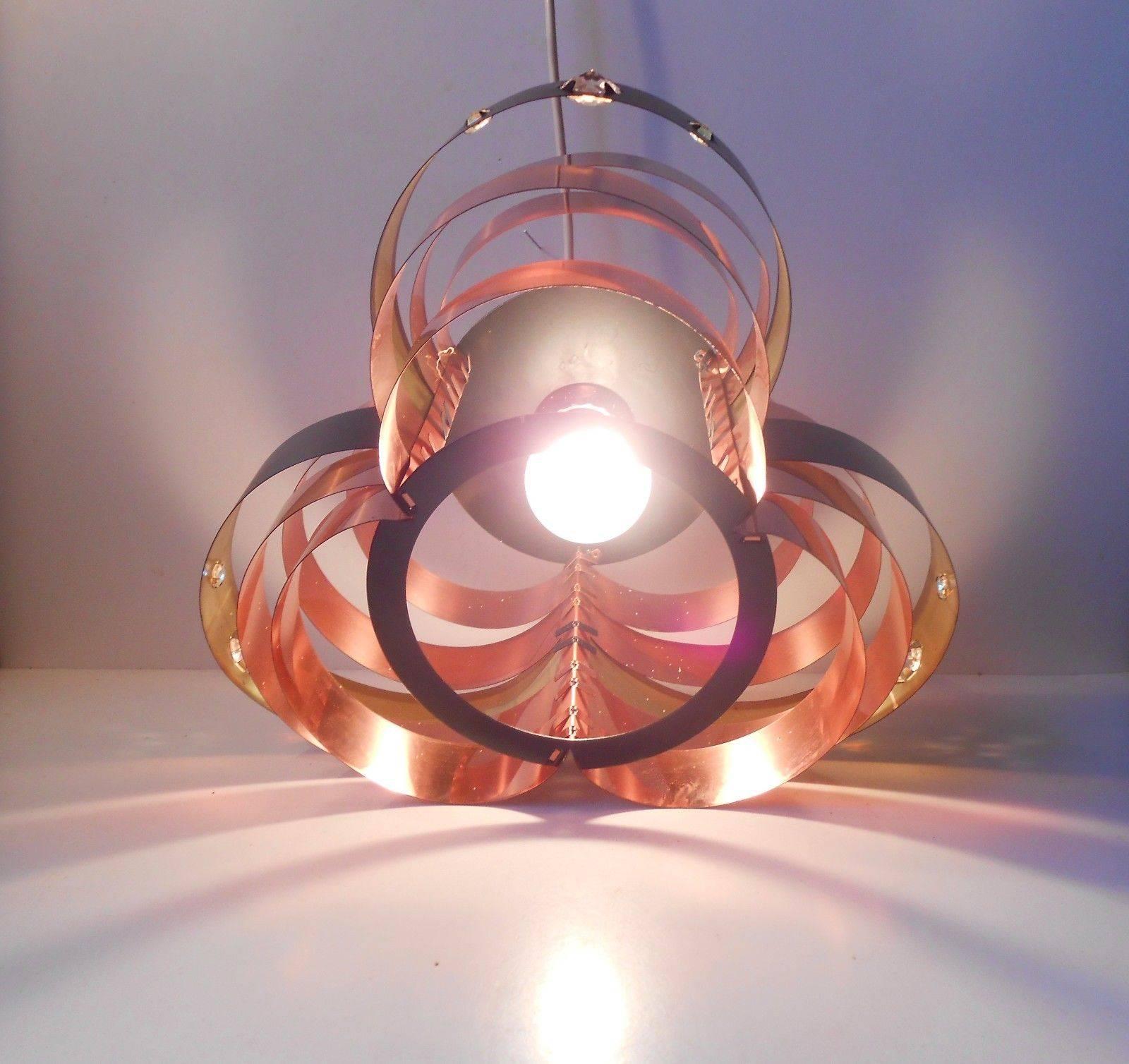 A Danish modern copper and glass chandelier by Verner Schou for Coronell. The model is called P66 - PB1. Measurements: D 14 inches, H 10 inches (35/25 cm).

 
