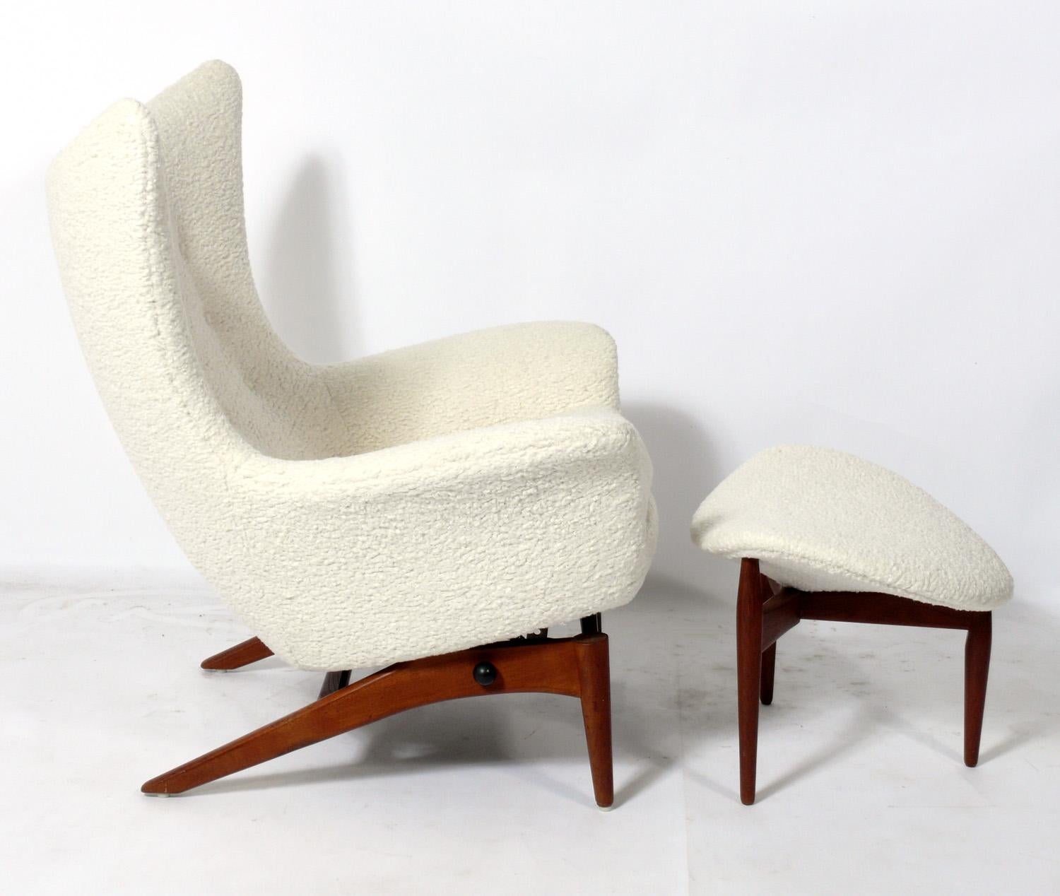 Sculptural Danish modern lounge chair and ottoman, designed by H.W. Klein for Bramin Mobler, Denmark, circa 1960s. The chair reclines with an adjustable handle on the side. It has been reupholstered in an ivory color faux shearling. All the plush
