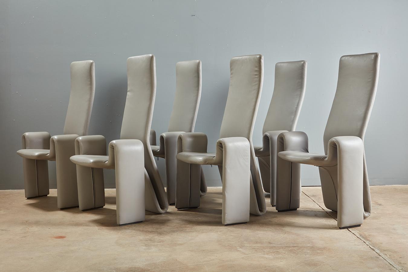 Sculptural and supremely comfortable set of chairs, tagged, by designer Steve Leonard. These are the dining chairs you can both admire for their silhouette AND comfort- high back is supportive but has give, leaning back with the sitter making them