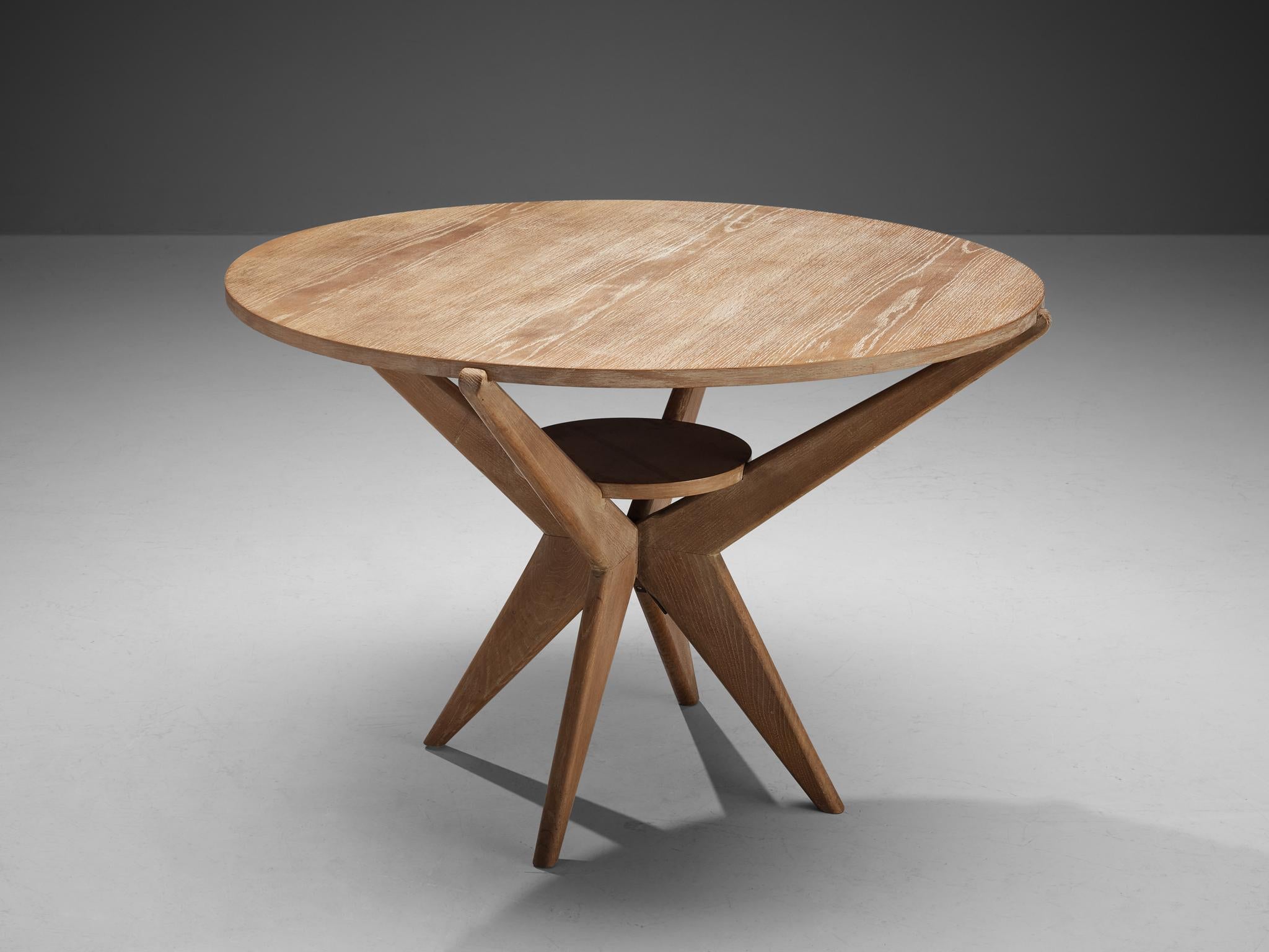 Dining or center table, cerused oak, Europe, 1960s 

This eccentric dining table is well-constructed in a precise manner implementing geometrical shapes and straight lines that contribute to its architectural appearance. In the highly sculptural