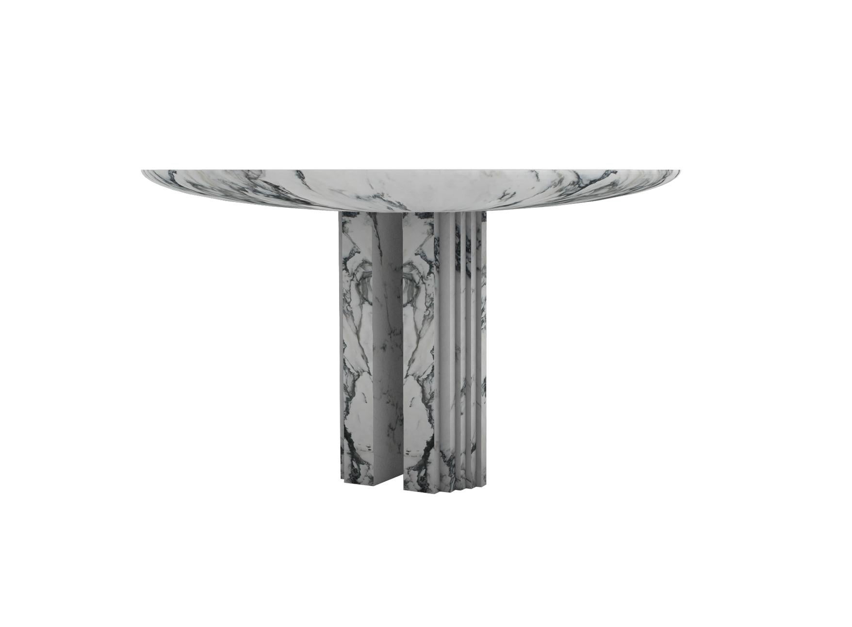 “Dining table 0024c” is a sculptural table in Paonazzo Marble created by the artist Desia Ava. 
The piece features strong lines and gentle curves. Marked by architectural aesthetics, on the borderline between sculpture and furniture the Marble block