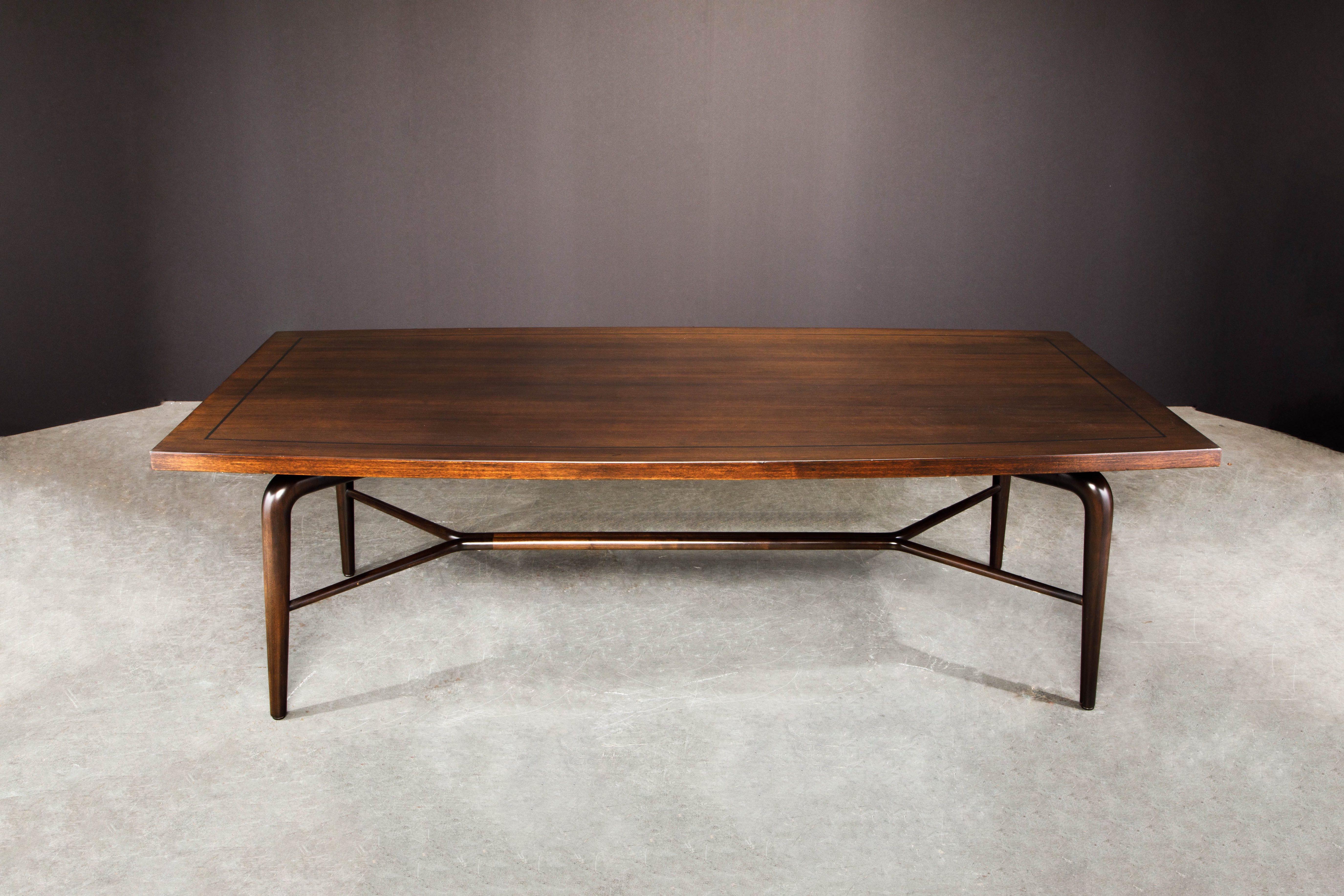 This large sculptural dining table by Maurice Bailey for Monteverdi-Young was crafted from Mahogany with ebony inlay and nicely finished in a satin-gloss lacquer. The base to this table is simply incredible - note the finely sculpted legs and