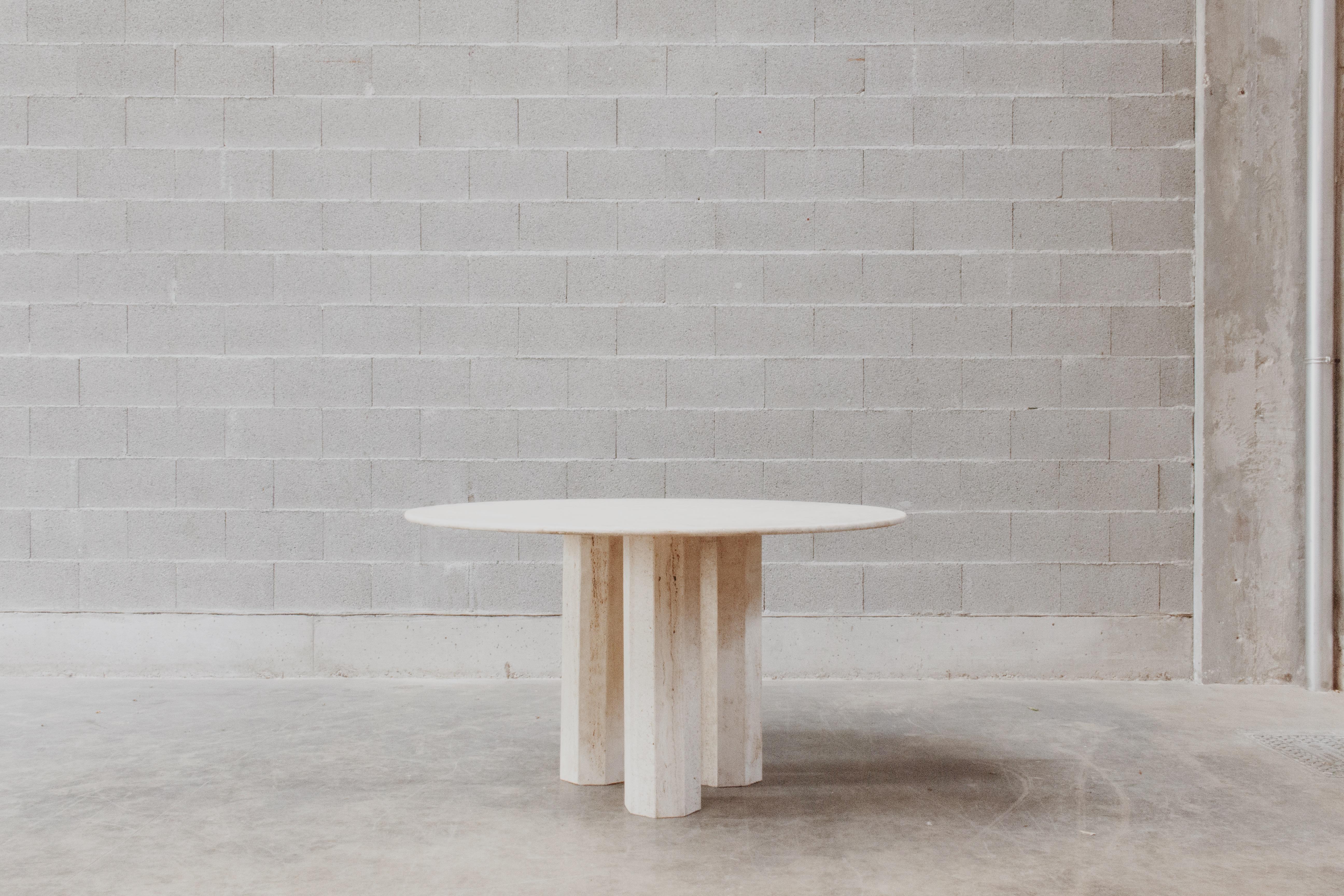 Sculptural dining table in travertine, Italy, 1975

This particular dining table reflects the typical sculptural Italian design of the 1970s. Entirely manufactured in Roman travertine, it comprehends three hexagonal legs supporting the round marble