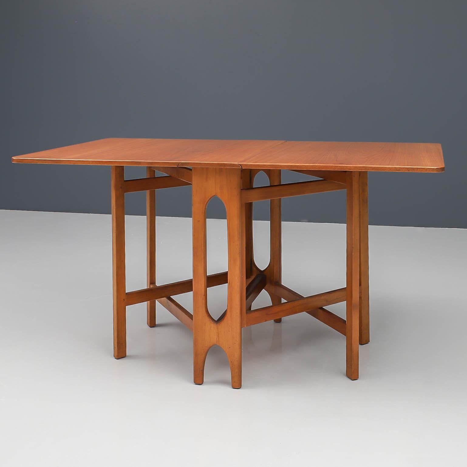 Clever dining table with interesting base that folds out to let the drop-leaves rest on. Nice geometrical shapes and made with a lot of care and precision. Very practical design and perfectly suitable for smaller houses in larger city's. The colour