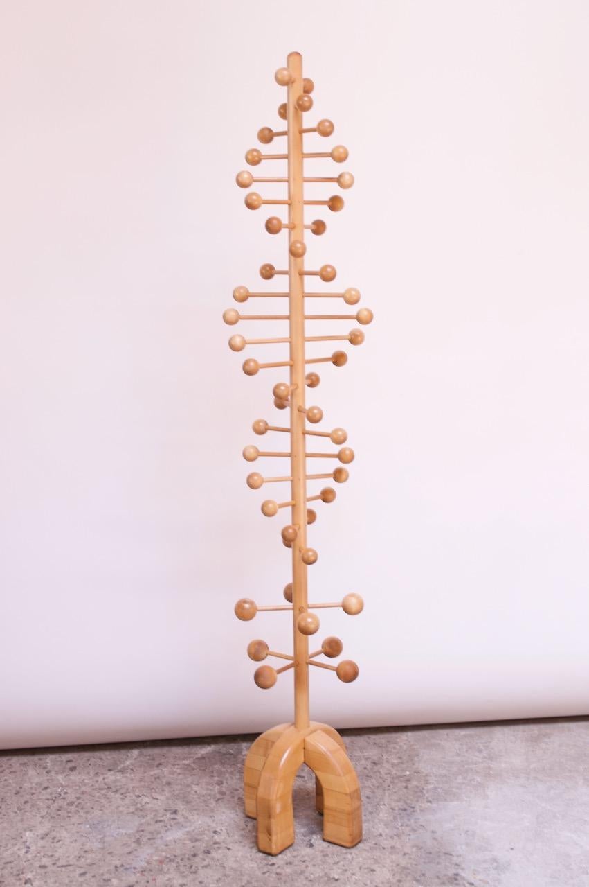 Charming Scandinavian coat rack / tree modeled after DNA. Peg and ball construction, handcrafted in solid maple.
Fine, vintage condition with minor wear consistent with age / use (namely, the staved maple base has two streaks of filler applied by