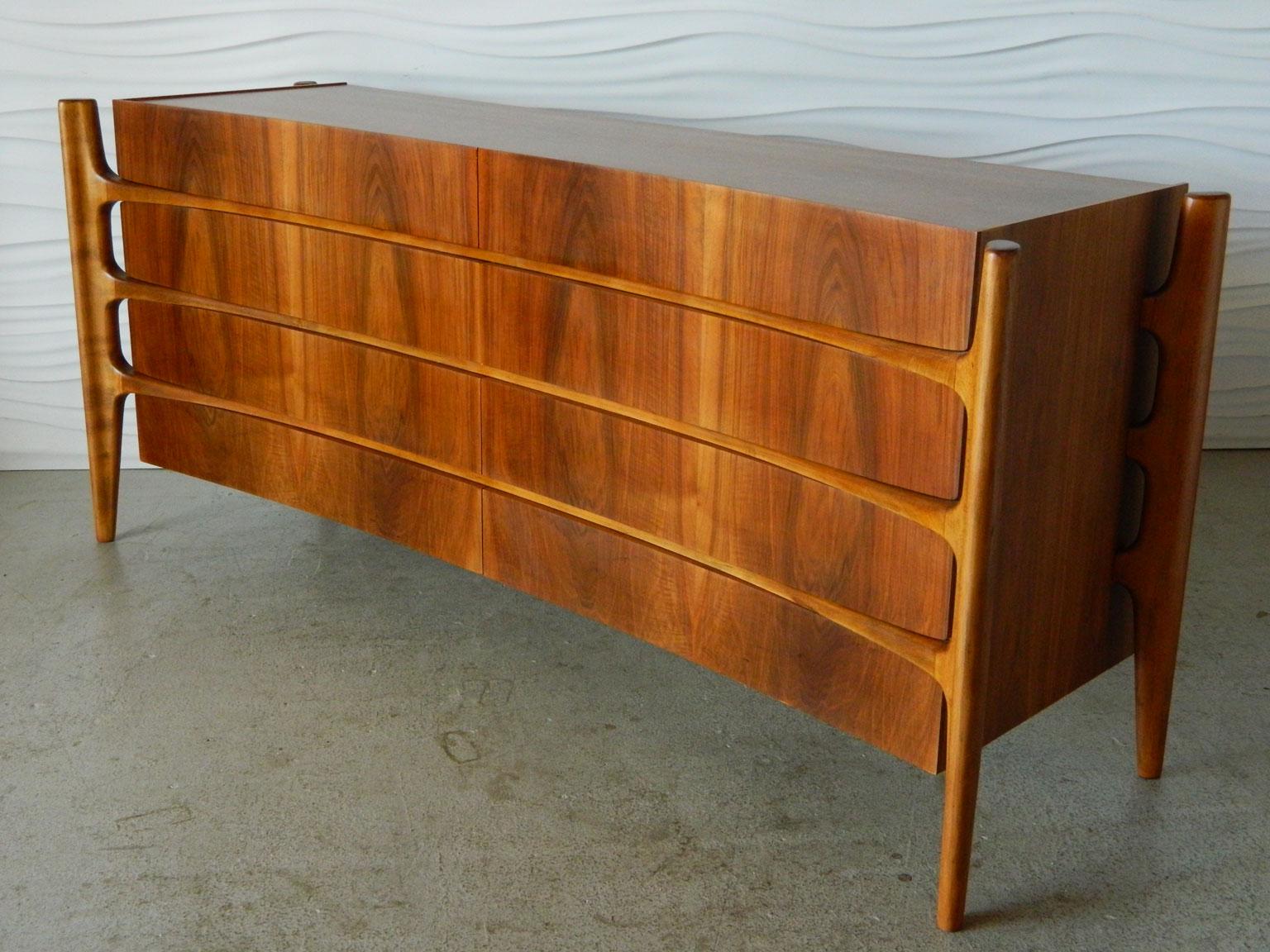 Made in Sweden in the 1960s, this handsome, curved dresser features eight generously-sized drawers.