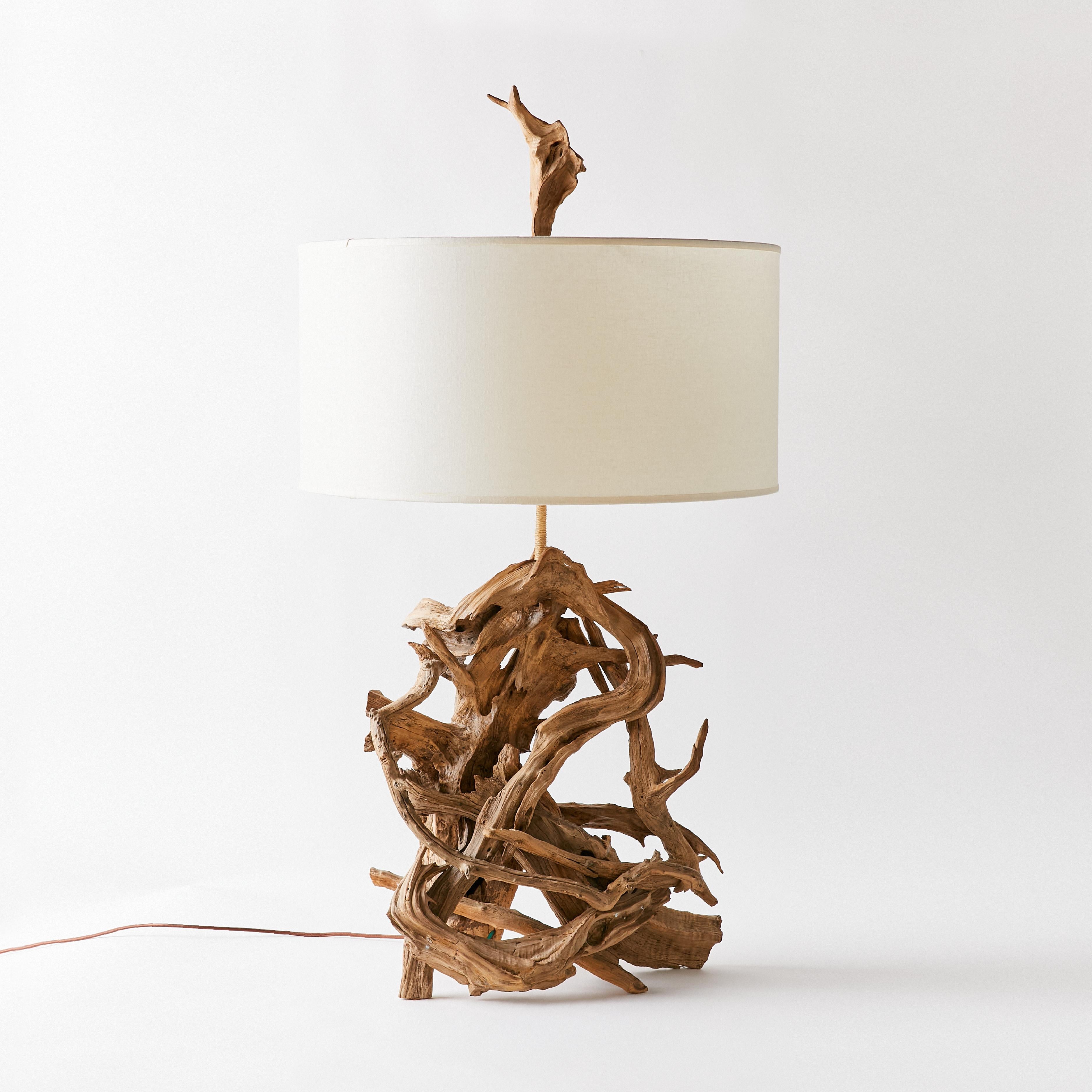 Sculptural mid-century driftwood lamp with its original well-worn natural patina.
This item comes with its original driftwood finial.