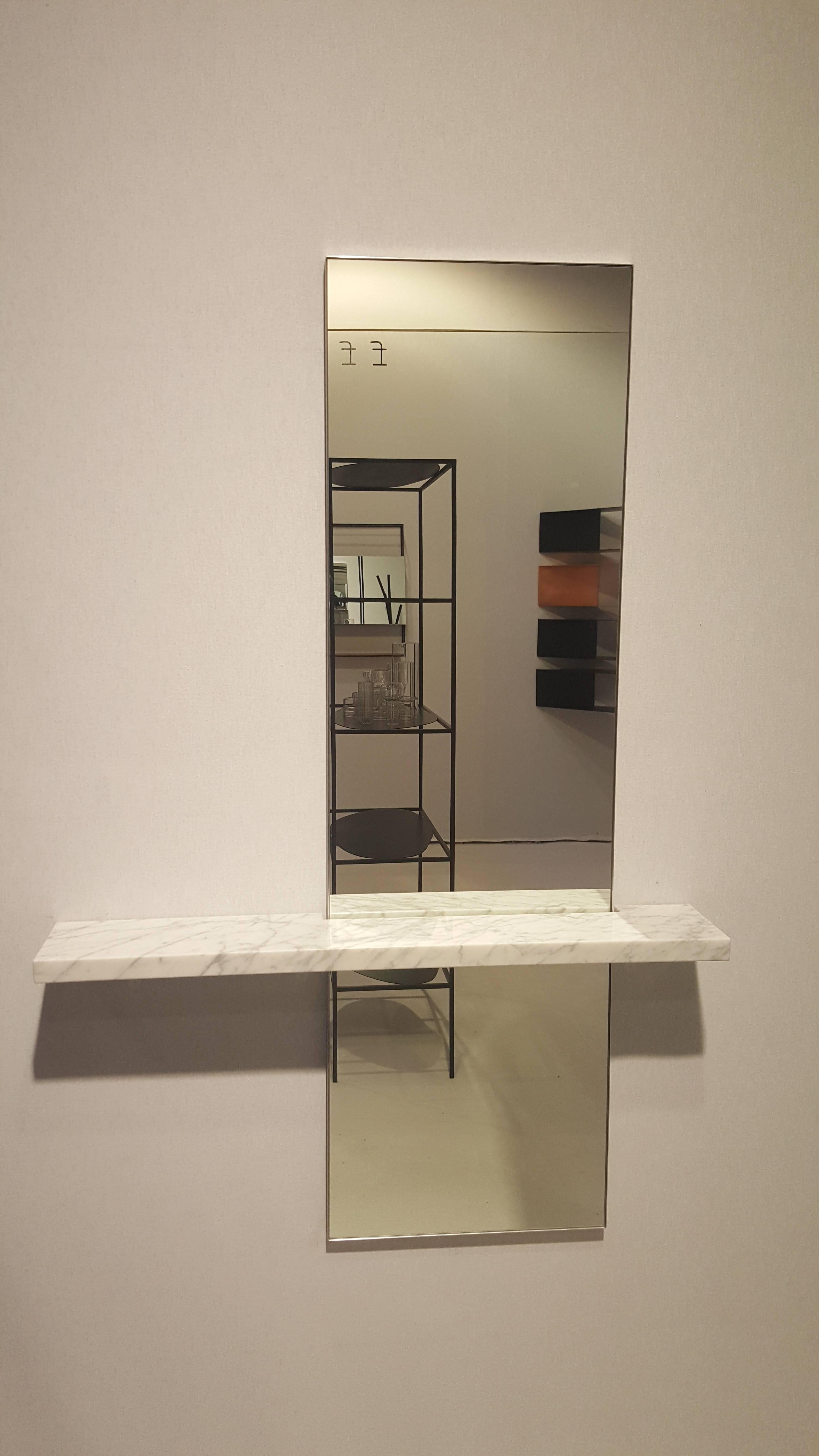 The minimal and contemporary wall-hung Edgewater mirror with shelf is perfect for an entryway, powder room or bedroom, this mirror with shelf is a rich balance between tension and harmony. The combination of materials work together in creating an