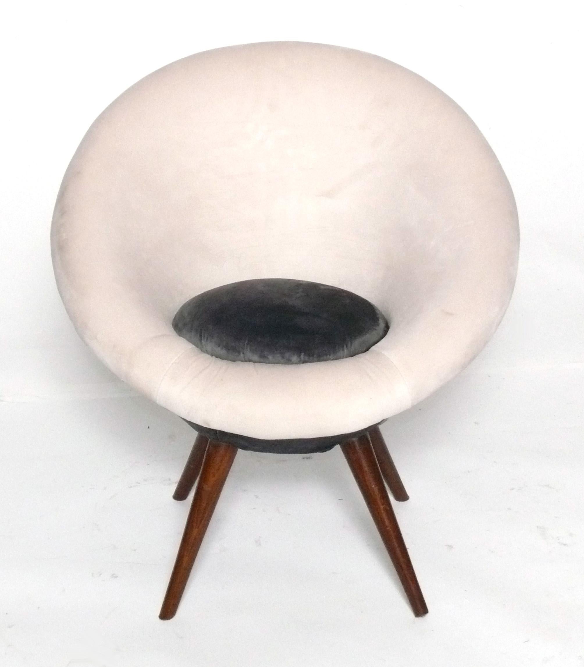 Sculptural Ouef or Egg Lounge Chair, circa 2000s. This is based on a 1950s French design and this example was produced in the 2000s. It is a petite size and would be great in a childs room.