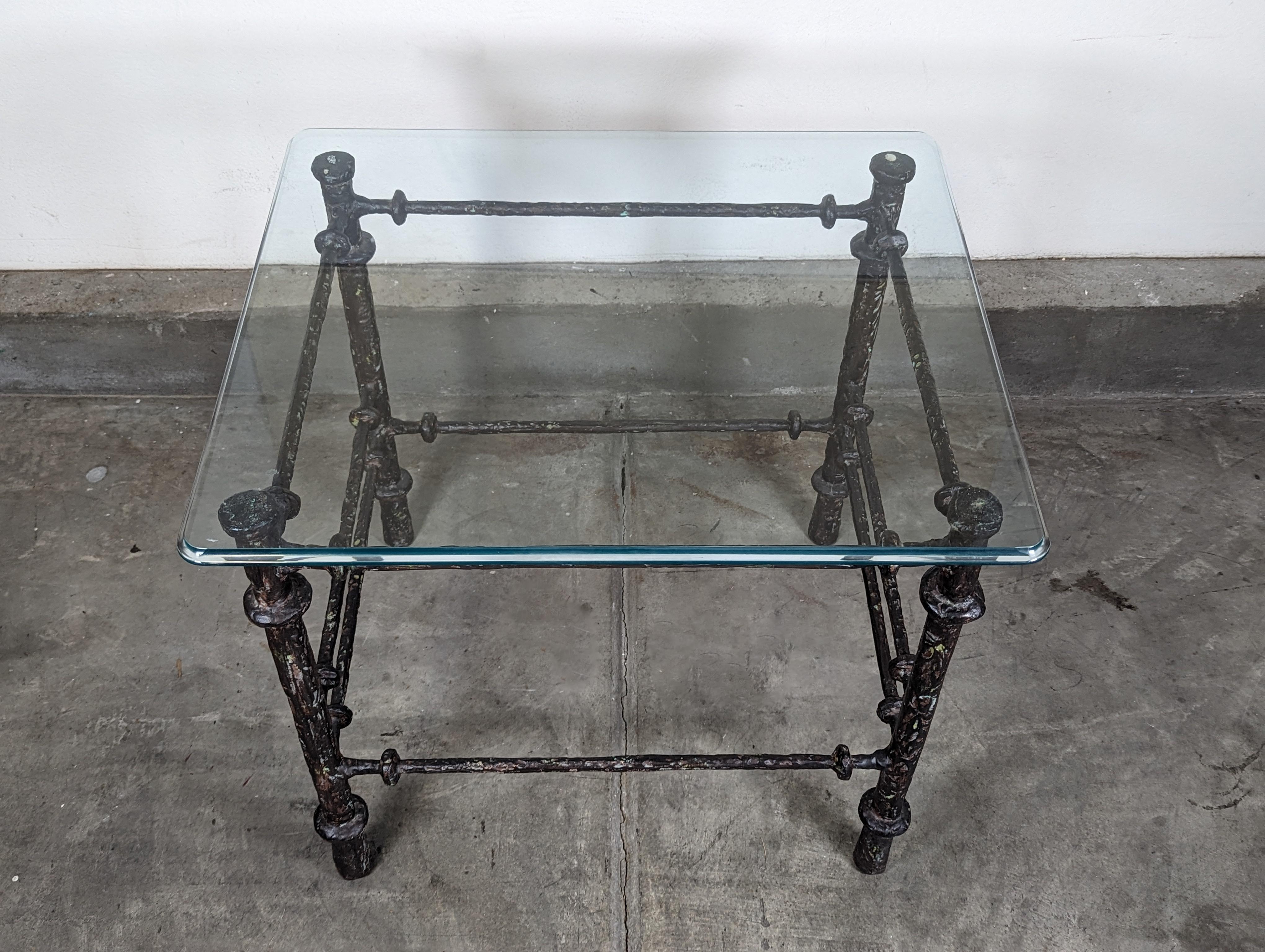 Elevate your living space with this exquisite vintage mid-century end table, reminiscent of the masterful artistry of Diego Giacometti. Crafted in the 1970s, this piece embodies the timeless elegance and sophisticated design characteristic of the