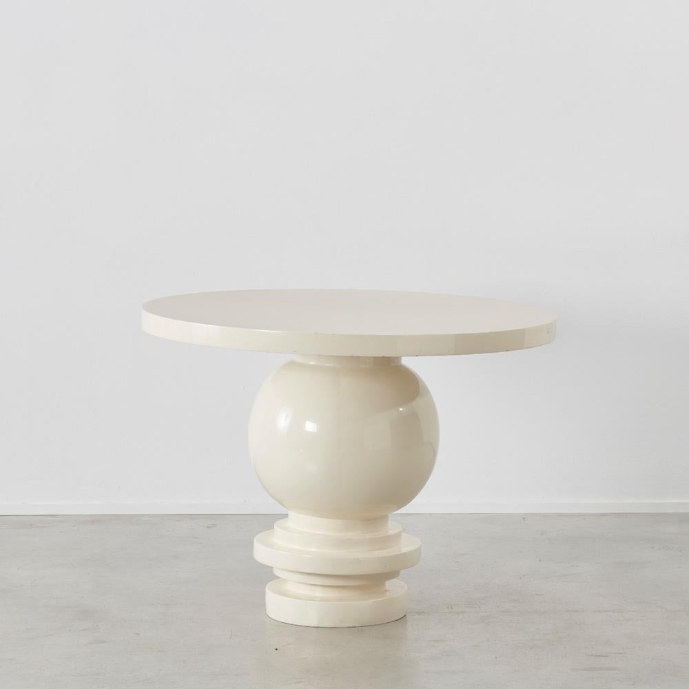 This charming round table caught our eye for its subtly wonky pedestal. This break from the use of truly square lines makes for a distinctive, sculptural and playful piece, in the manner of a side table by Serge Castella.

The table looks appears