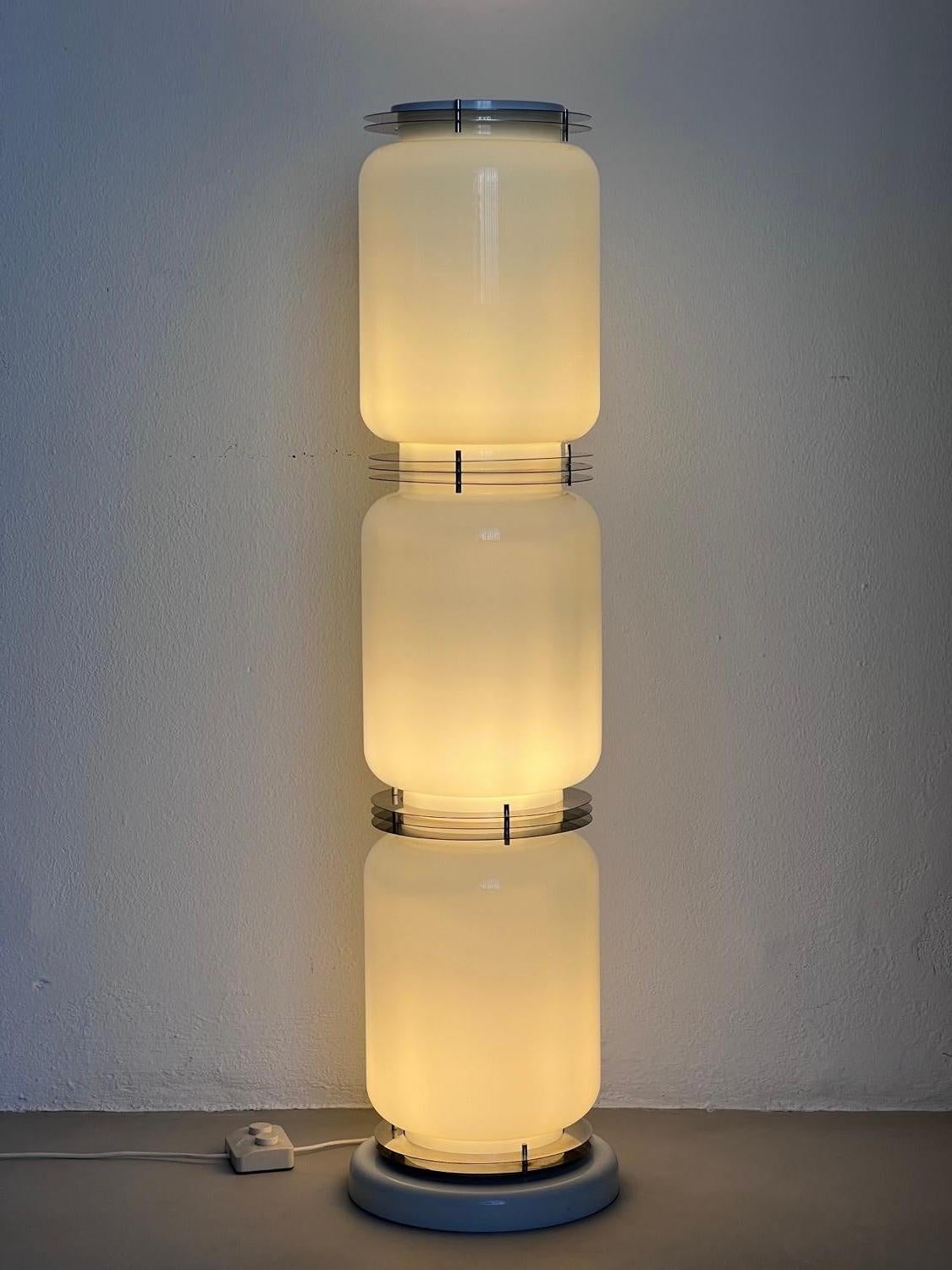 Chrome Sculptural floor lamp by Enrico Tronconi For Sale