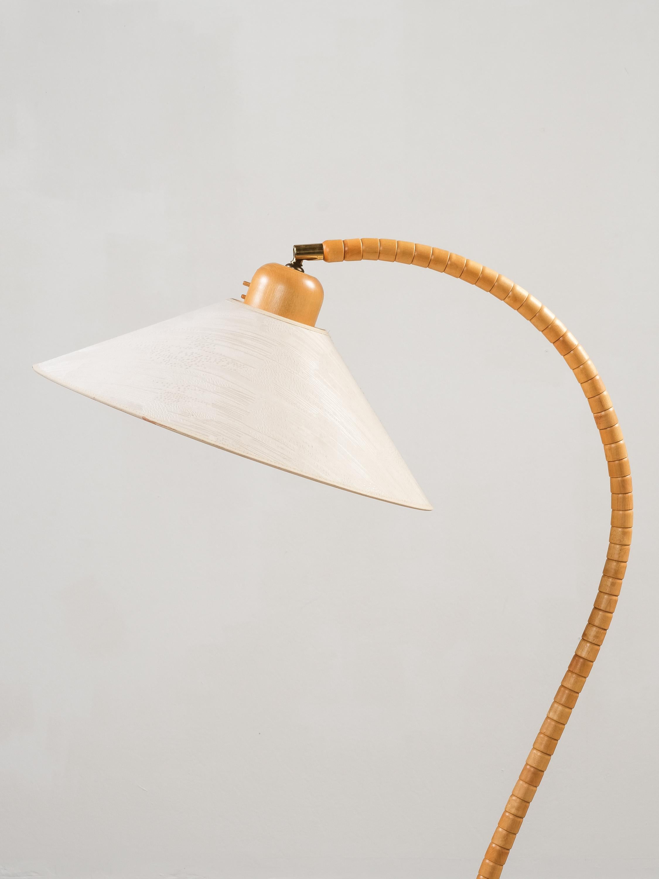 This striking floor lamp was produced by Markslöjd in Kinna, Sweden, in the 1970s. The piece is marked with the Markslöjd label and model number on the underside of the base.

The design is characterized by a sculptural, organically shaped frame