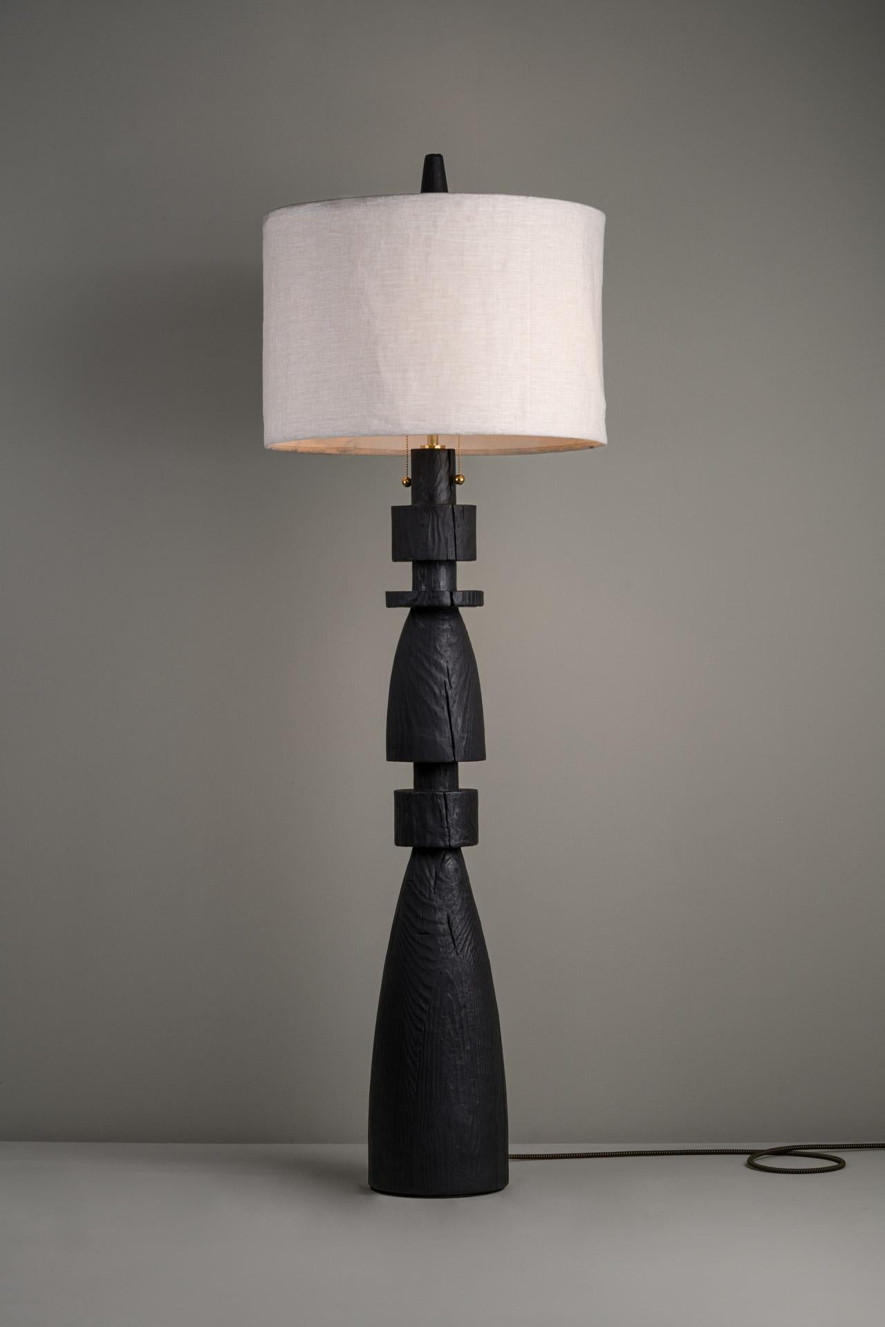 MEZQUITE (LARGE) floor lamp was designed for the De Palo collection by Mexican artist Isabel Moncada.

Like a chess bishop, Mezquite makes its presence felt in a resounding manner. It has a sturdy wood base, its dark finish gives great character and
