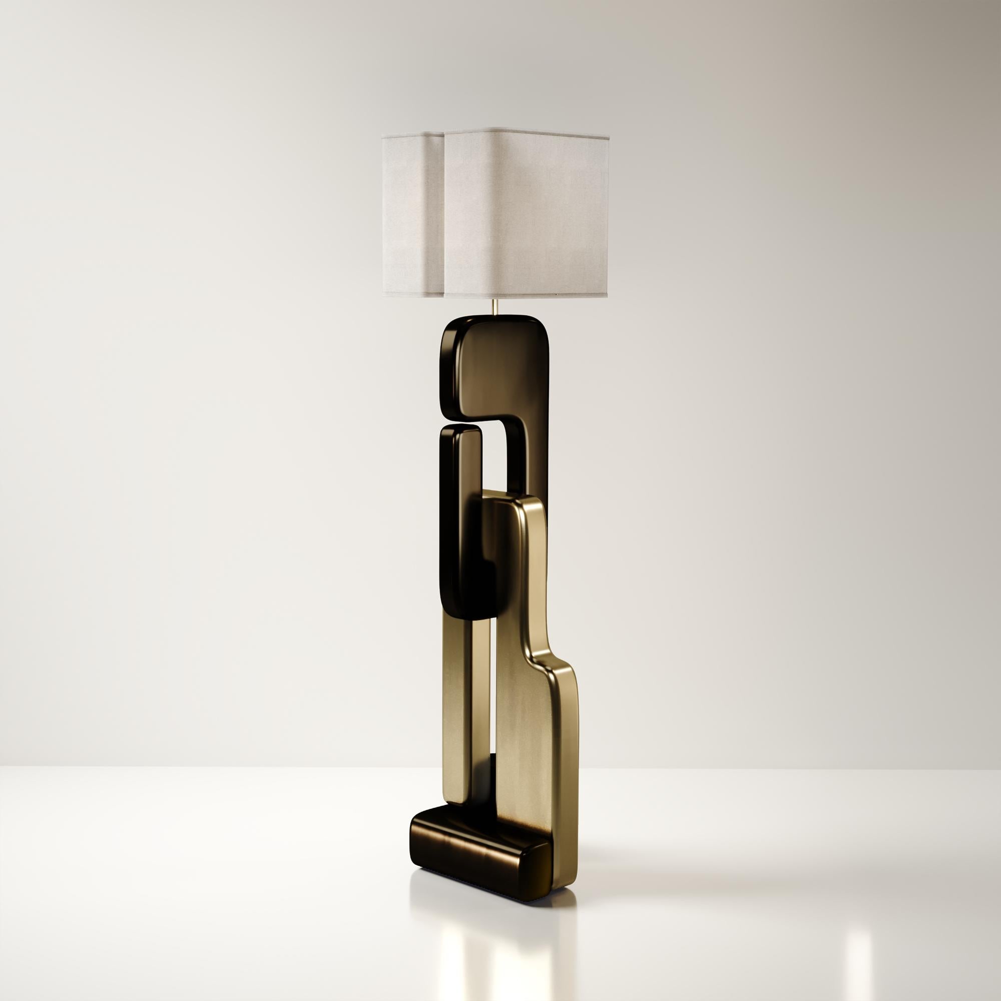 The Apoli floor lamp by Kifu Paris is both dramatic and organic it’s unique design. The ethereal geometric and sculptural base is made entirely from bronze-patina brass. This piece is designed by Kifu Augousti the daughter of Ria and Yiouri