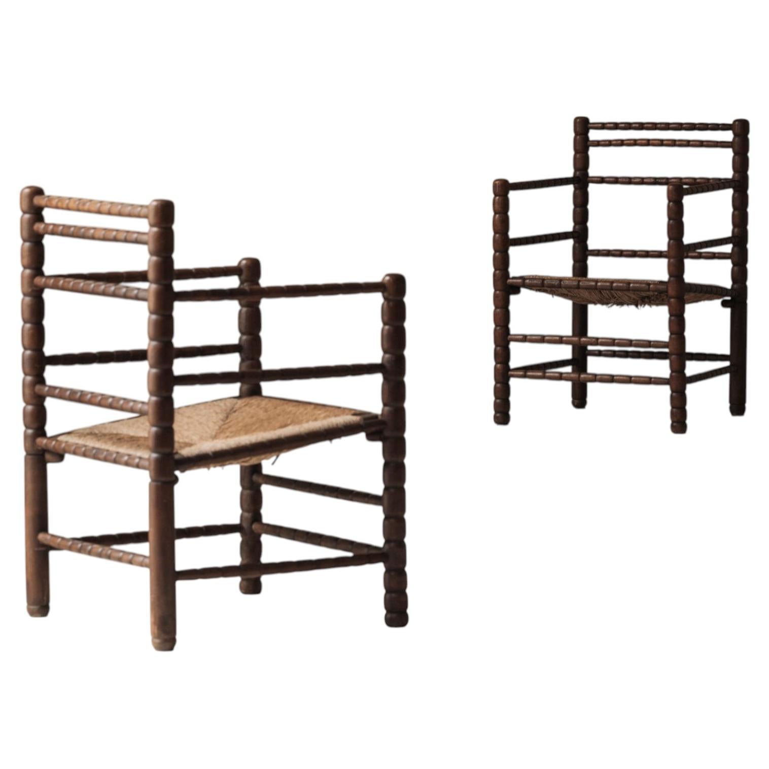 Sculptural French 'Bobbin' armchairs, 1950s For Sale