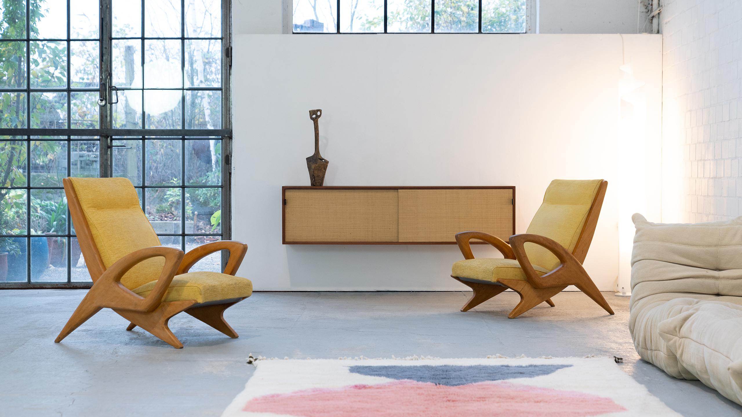 This pair of sculptural armchairs comes from a private collection of modern wooden designs in France. The collection includes virtually the complete range of French designers, such as Pierre Chapo, Charlotte Perriand, Georges Candilis and