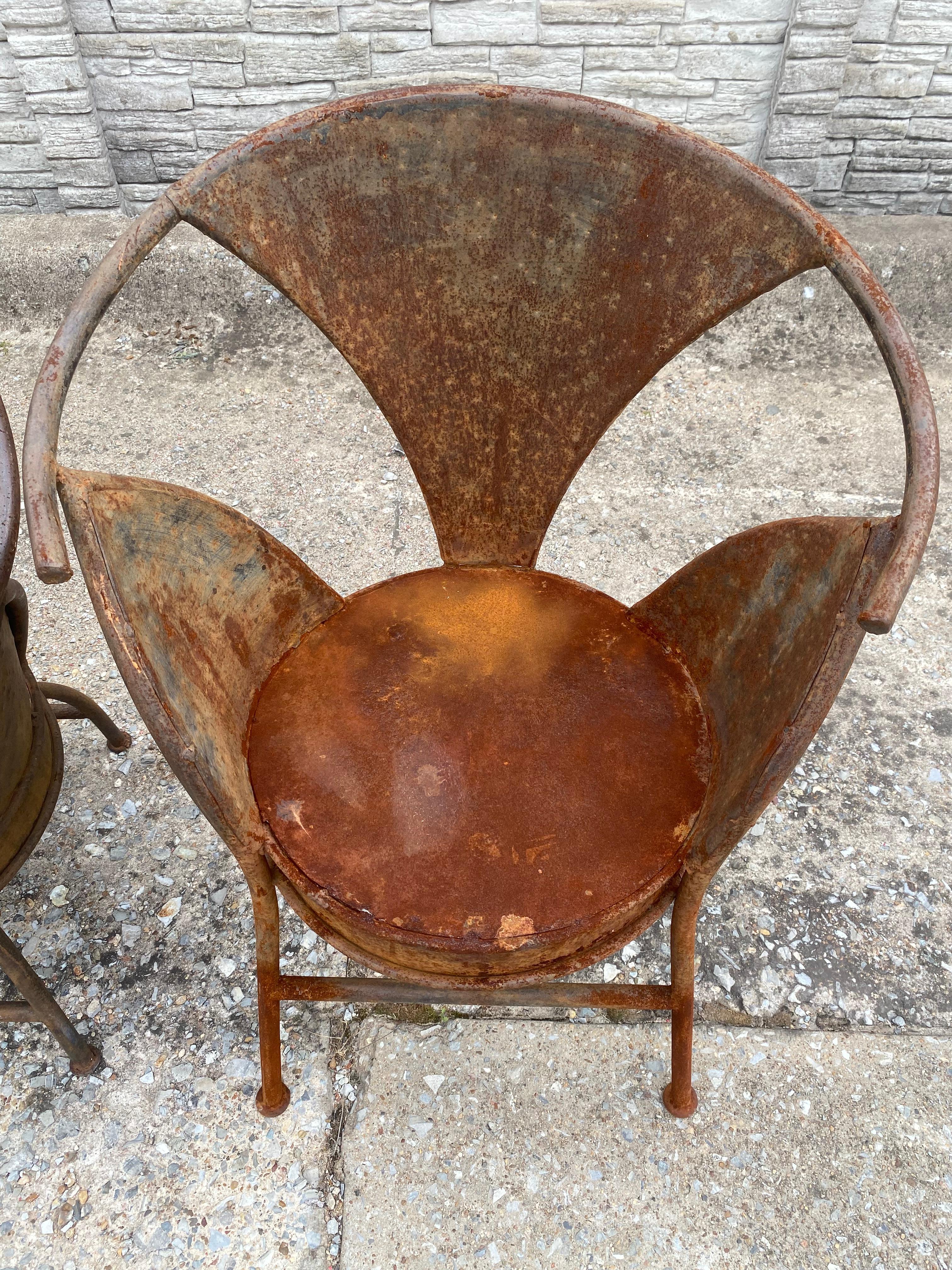 A welded steel bistro/patio chair from France. All original wear and heavy developed patina to the sculptural rounded form. Wonderfully weighty and quality construction. Cleaned and treated with a sealant/protectant (May 2025). We love the idea of a