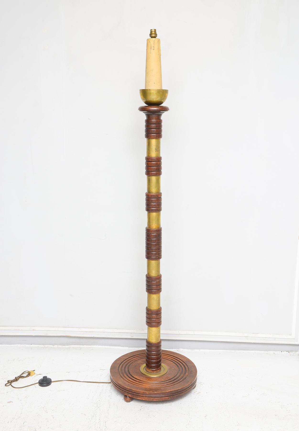 Sculptural French Mid-Century floor lamp with brass rings.
Diameter of the Base is 16