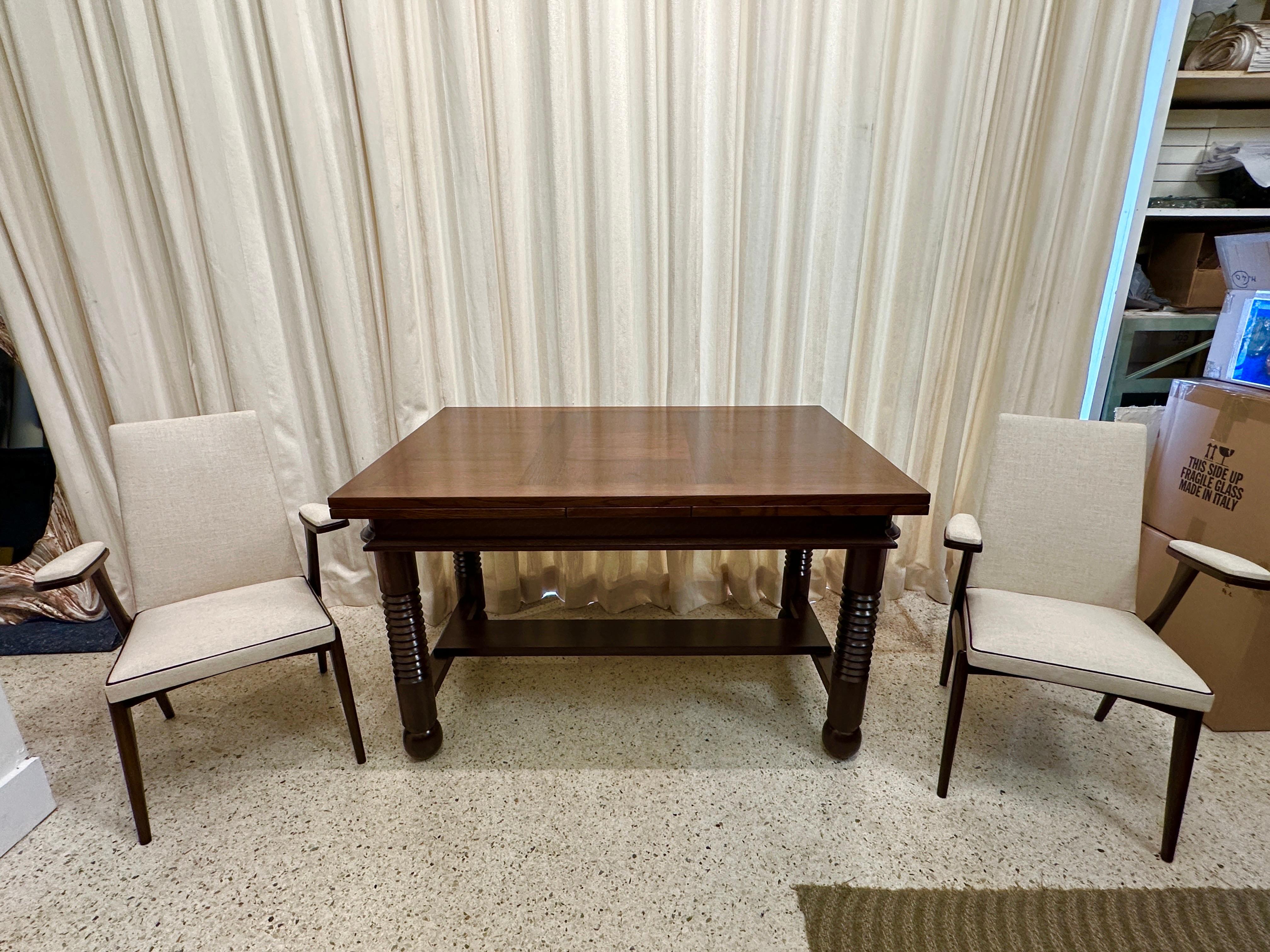 WOW!  What amazingly chic and sculptural chairs with floating armrests and SO MANY details.  French walnut wood in a rich dark espresso finish, newly upholstered with a neutral thick Belgian linen and brown linen piping trim, ALL finished with nail