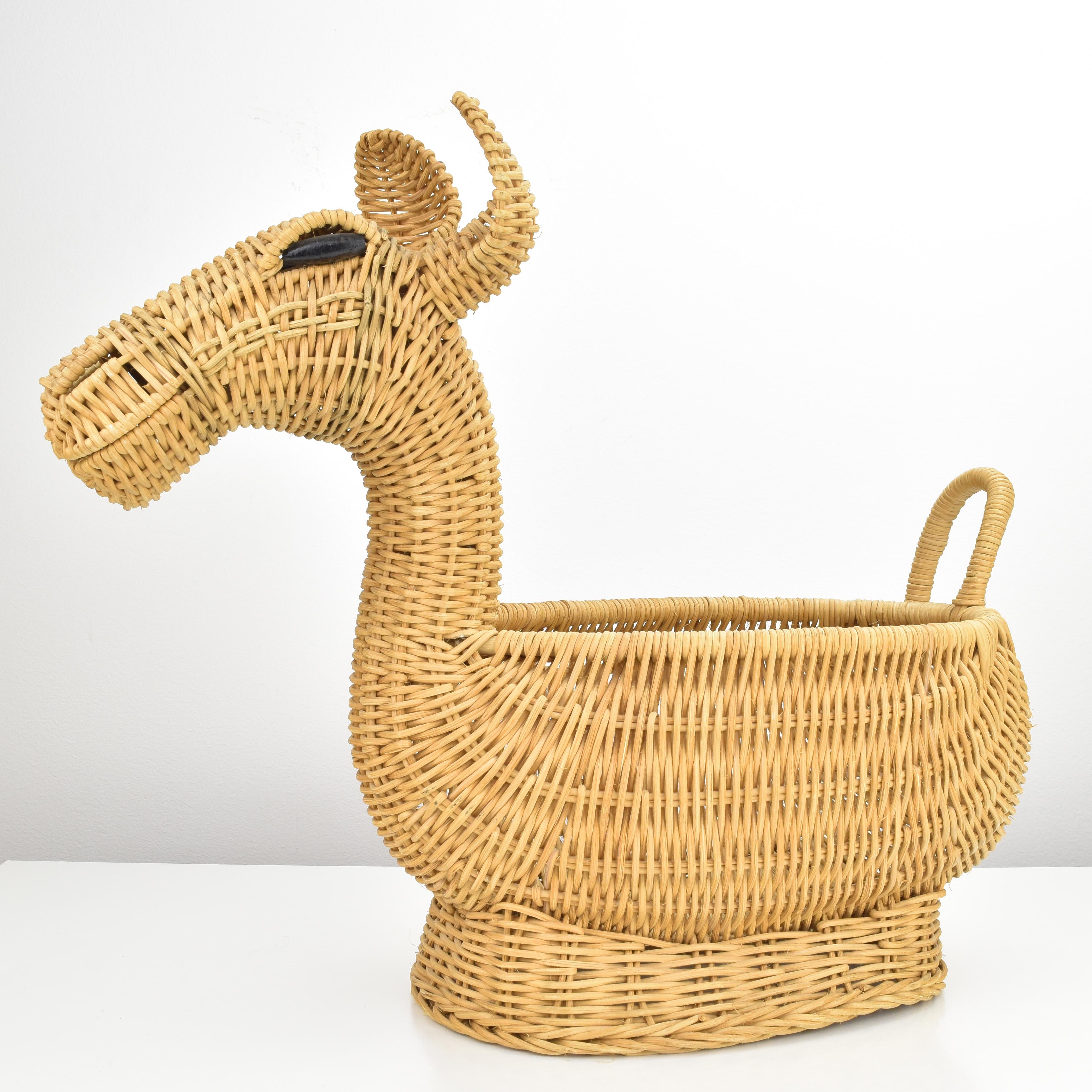 Playful vintage French wicker decorative basket in the shape of an alpaca, lama or camel in the style of Mario Torres. Finely crafted and in perfect condition this piece looks like unused and would be perfect for you to hold toys, fruits, or a plant.