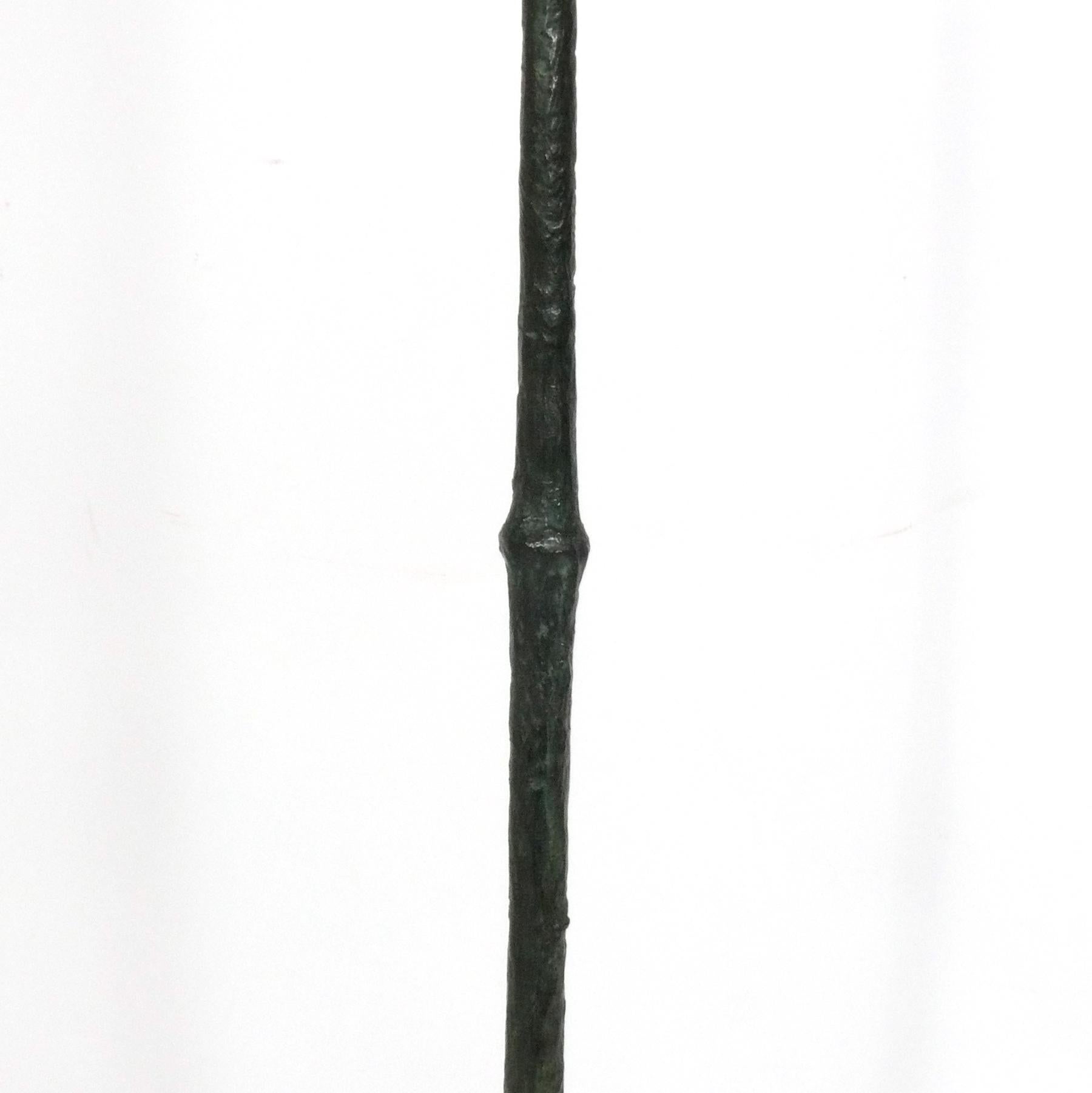 Sculptural bronze floor lamp, in the style of Diego Giacometti, French, circa 1970s. We are unsure if this is constructed of bronze, or a bronze finished metal with a verdigris patina. It has been rewired and is ready to use. The base measures