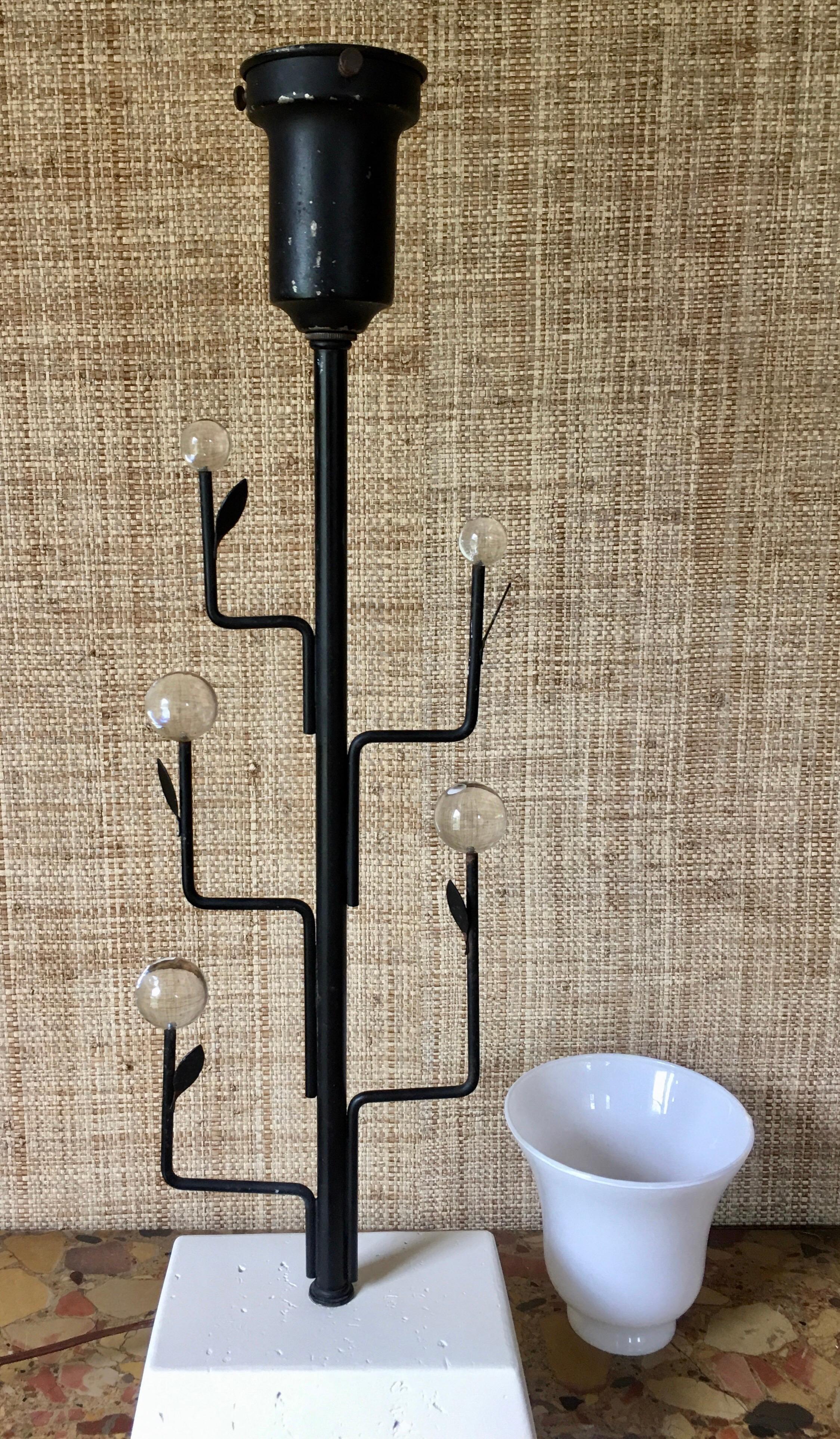 Mid-Century Modern Italian tree form table lamp in the style of Giacometti. Sculptural black iron branches support decorative clear balls. Mounted on a plaster base. Glass shade included. Black lamp shade not included.