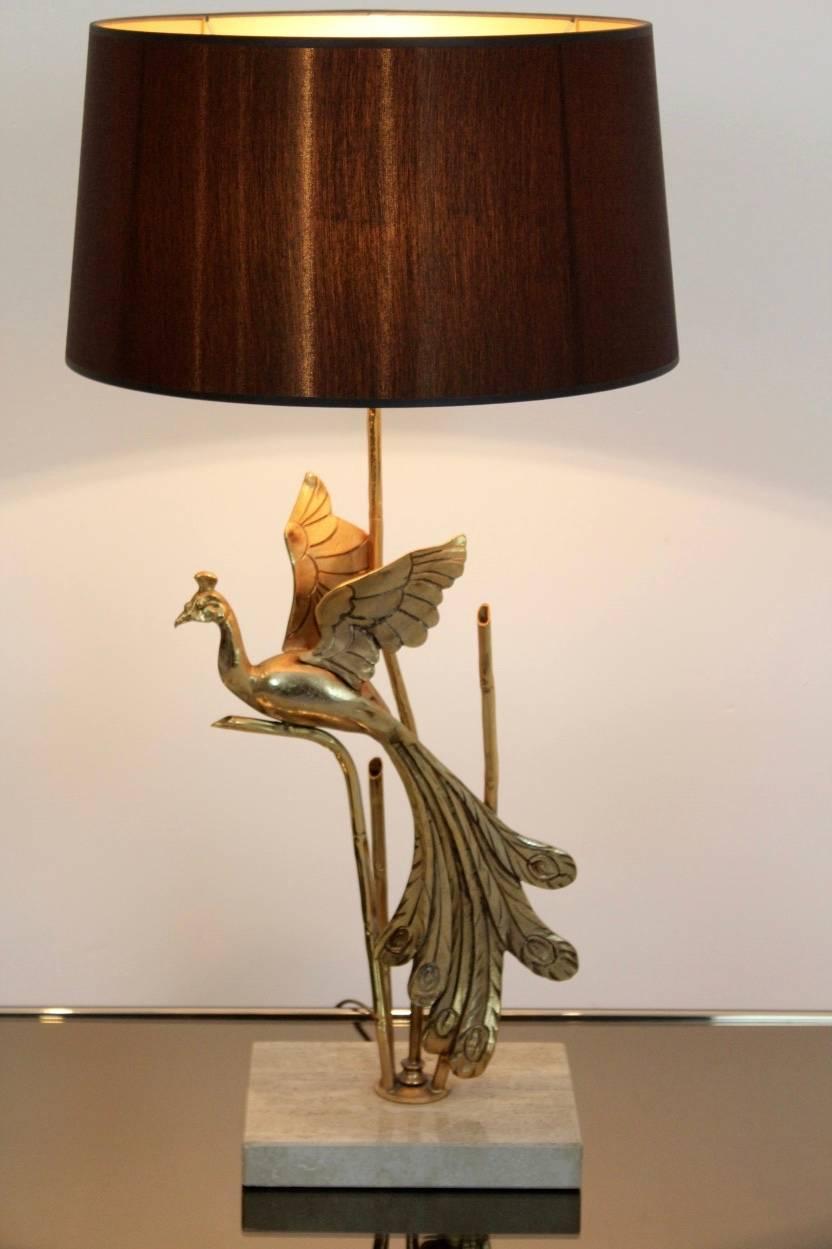 A truly eye-catching, unusual gilt metal table or floor lamp, fashioned in the shape of a Peacock. Designed in the style of Maison Jansen and produced circa 1970s in Belgium. The Peacock has a beautiful original Patina and the lamp is in excellent