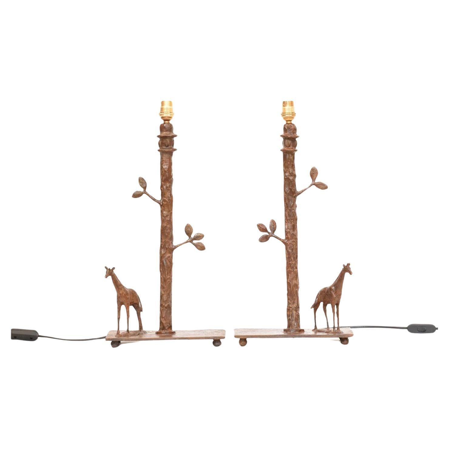 Handcrafted Sculptural Giraffe Table Lamps in cast bronze made using the lost wax method. Comes as a pair, excludes lamp shades. Sculpted, cast and finished individually by hand.

Height 41 cm (includes brass light fittings, excludes lamp shades).