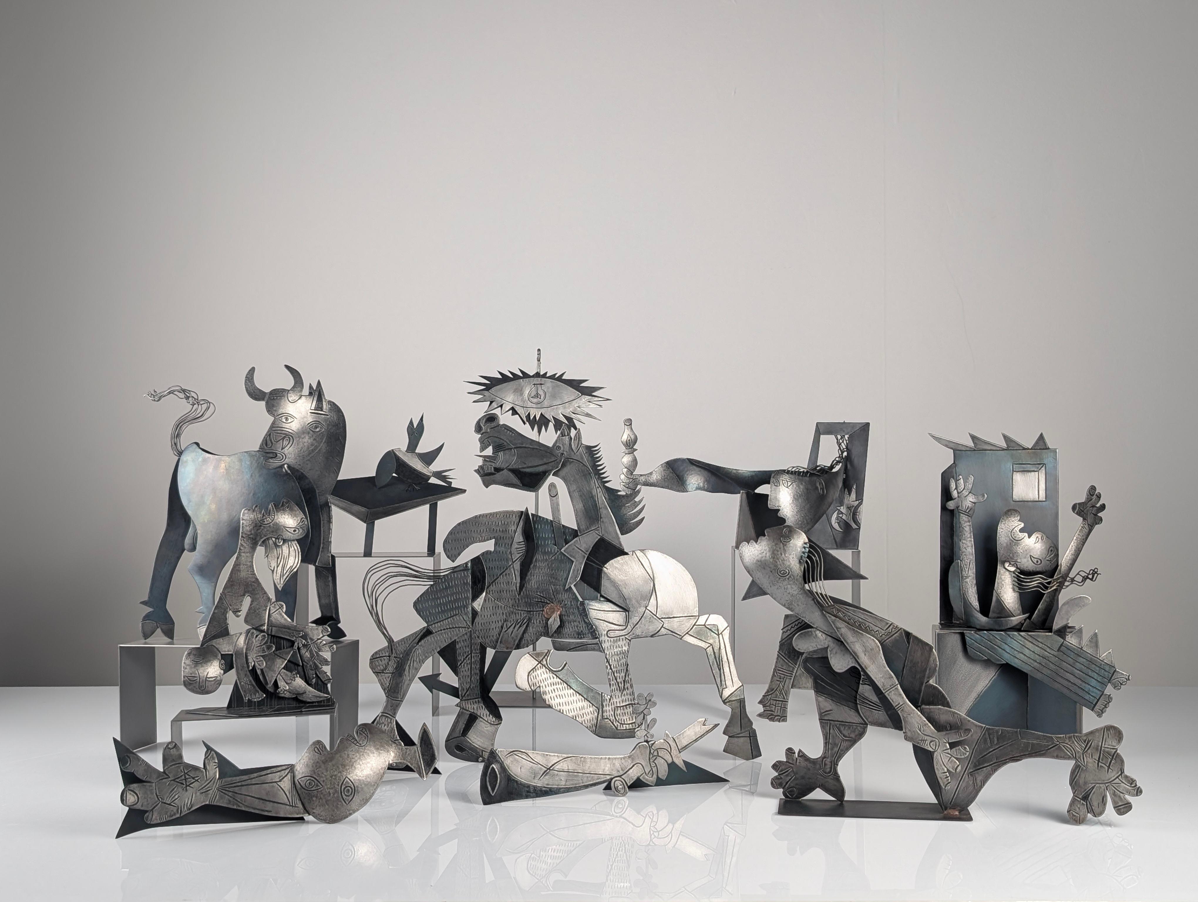 Striking large-format metal sculpture group offering a three-dimensional interpretation of Pablo Picasso’s iconic mural Guernica. This ensemble translates the symbolic and emotional power of the original painting into sculptural language, where each