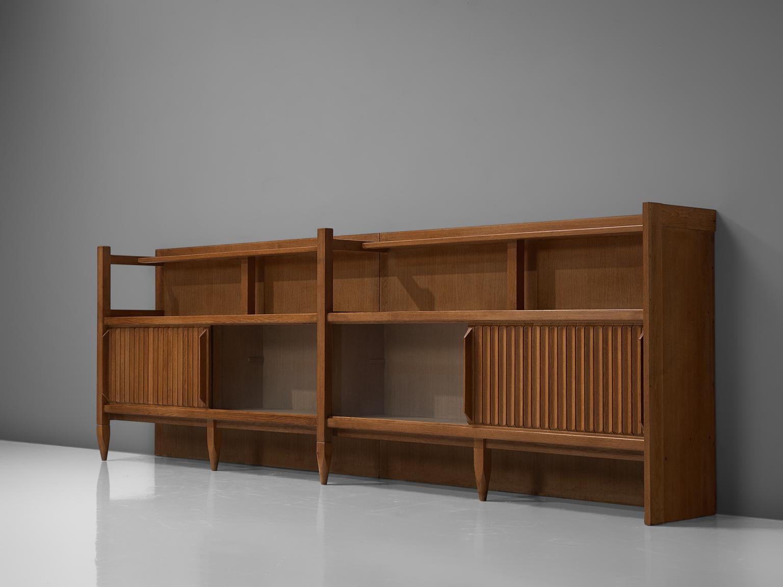 Guillerme et Chambron, large credenza, France, 1960s

This characteristic sideboard in solid oak holds is designed by the French designer duo Jacques Chambron (1914-2001) and Robert Guillerme (1913-1990). It has large and beautiful storage spaces