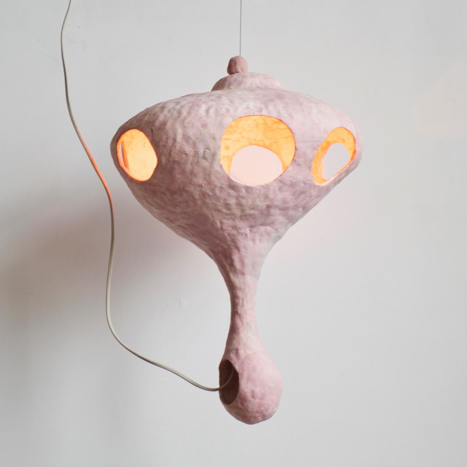 Floating objects surround you. You wonder if you too are floating in space, or perhaps in water. Gravity, the horizon, and the edges of the room disappear. You are happy.

Al-Fah is a pendant lamp from You See a Sheep, a lighting collection that